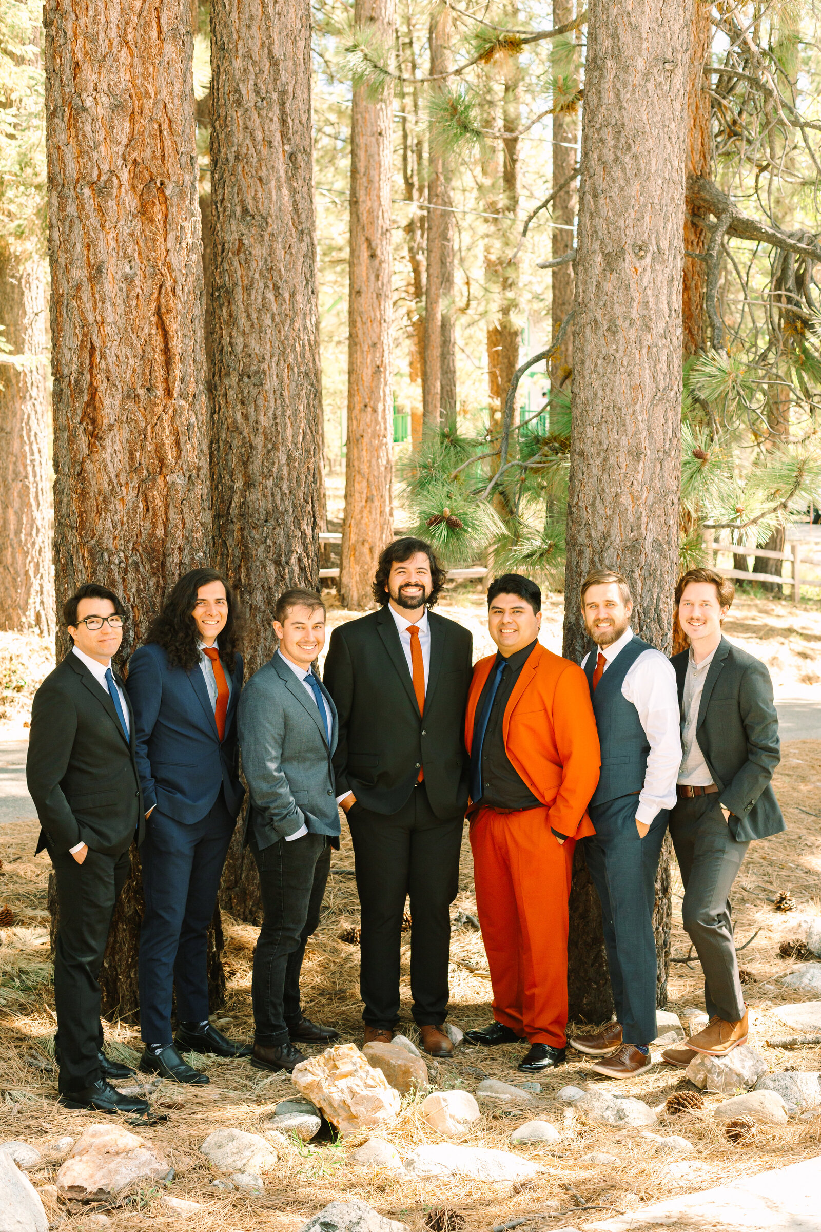The bridal party celebrates an intimate elopement at a cabin at Big Bear Lake, California.