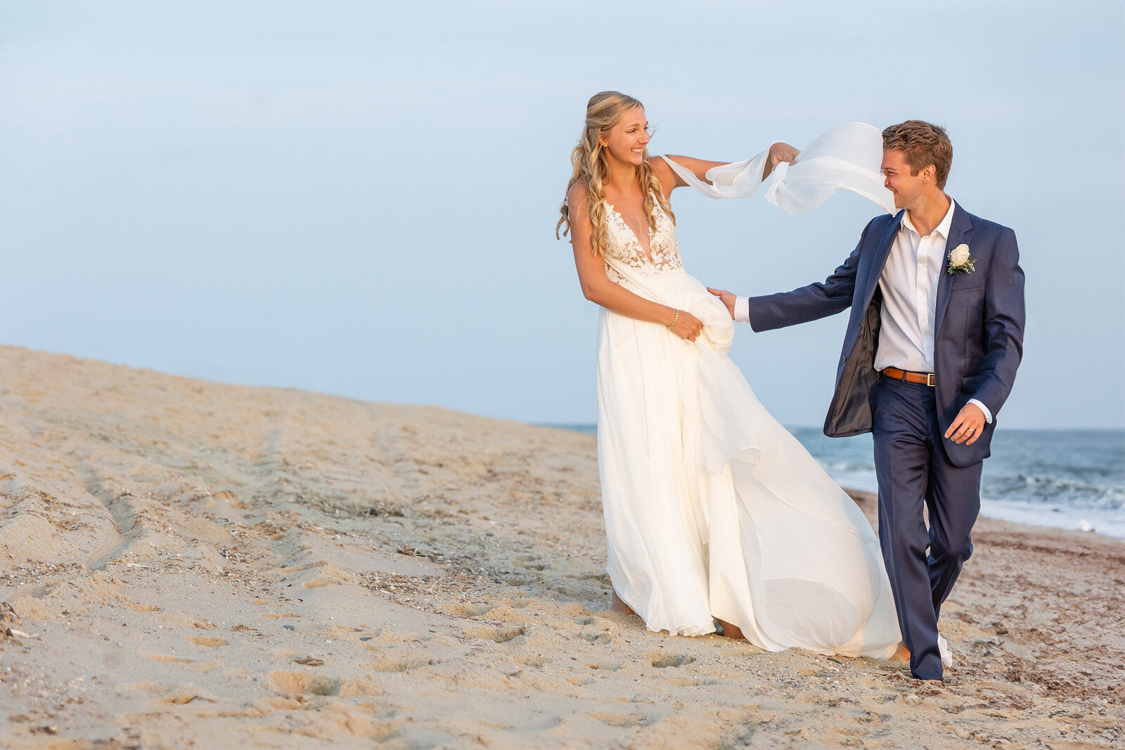 bridal veil blows in grooms face on nantucket beach