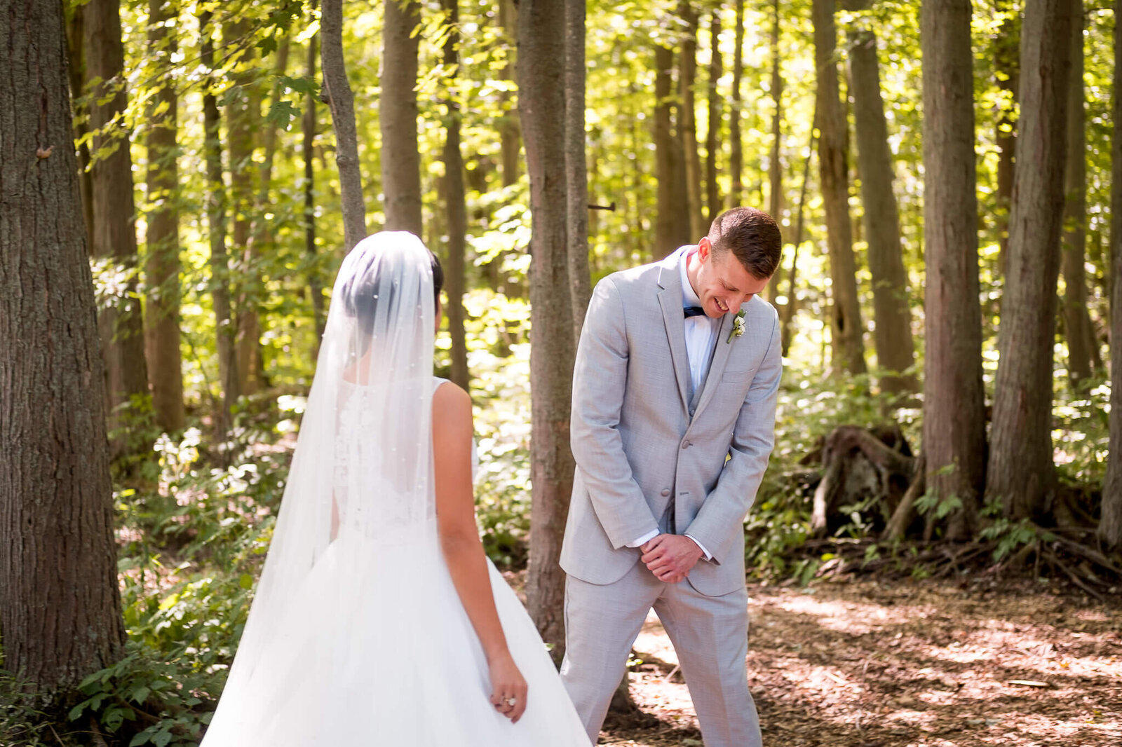 Groom's reaction during first look at The Clearing Shedden wedding venue.