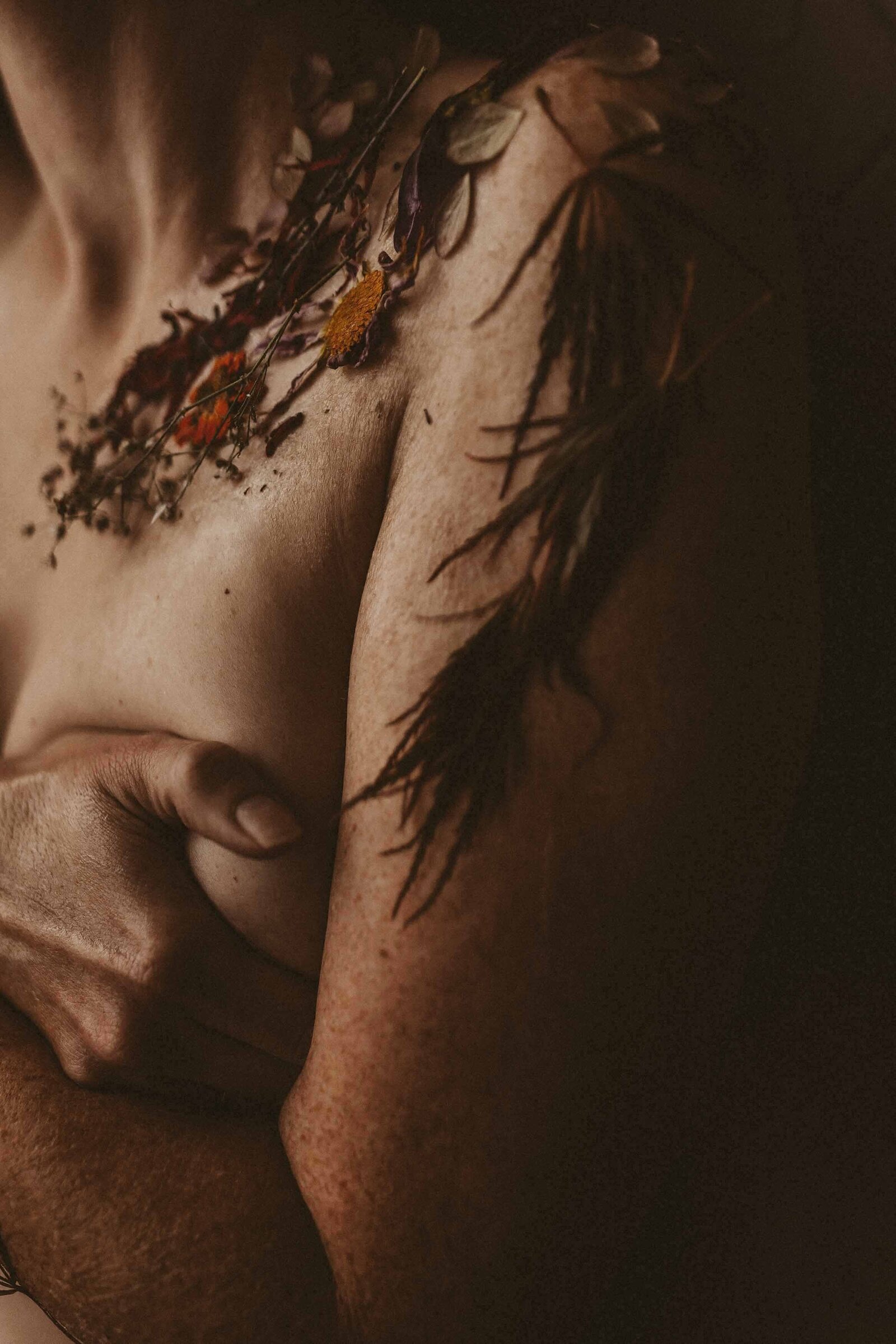 topless woman holding her chest