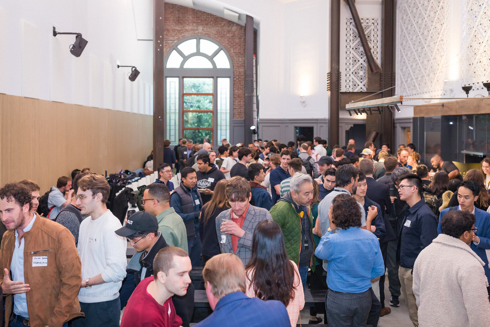 Wide shot of the Holy Shift event with guests listening to the keynote.