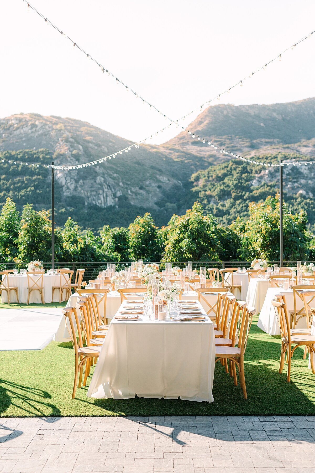 Reception detail photos in front of a mountain at sunset taken by Sherr Weddings married photography and videography team in San Diego.