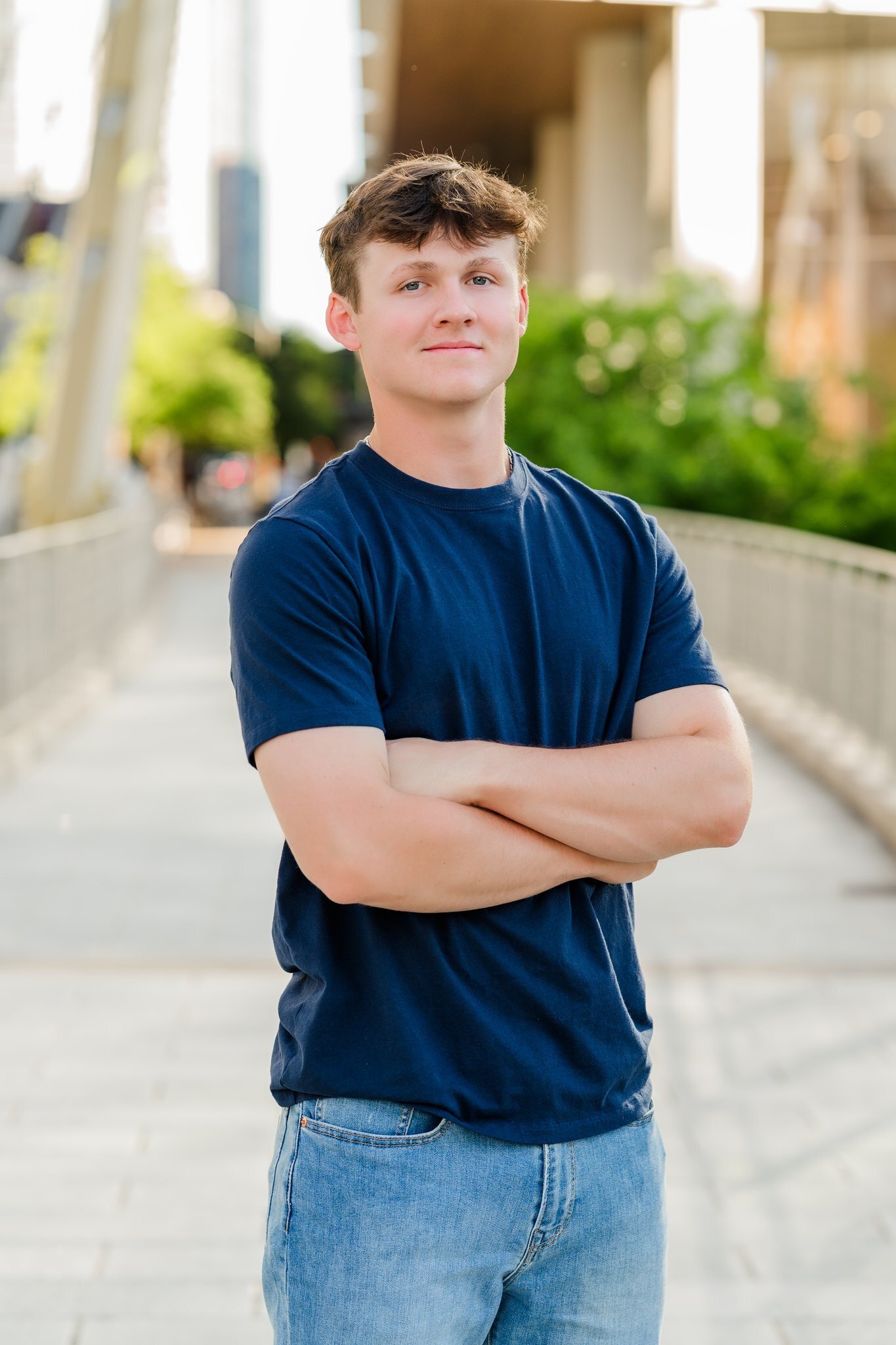 Wimberley High School Senior guy posing at Butterfly Bridge Austin 