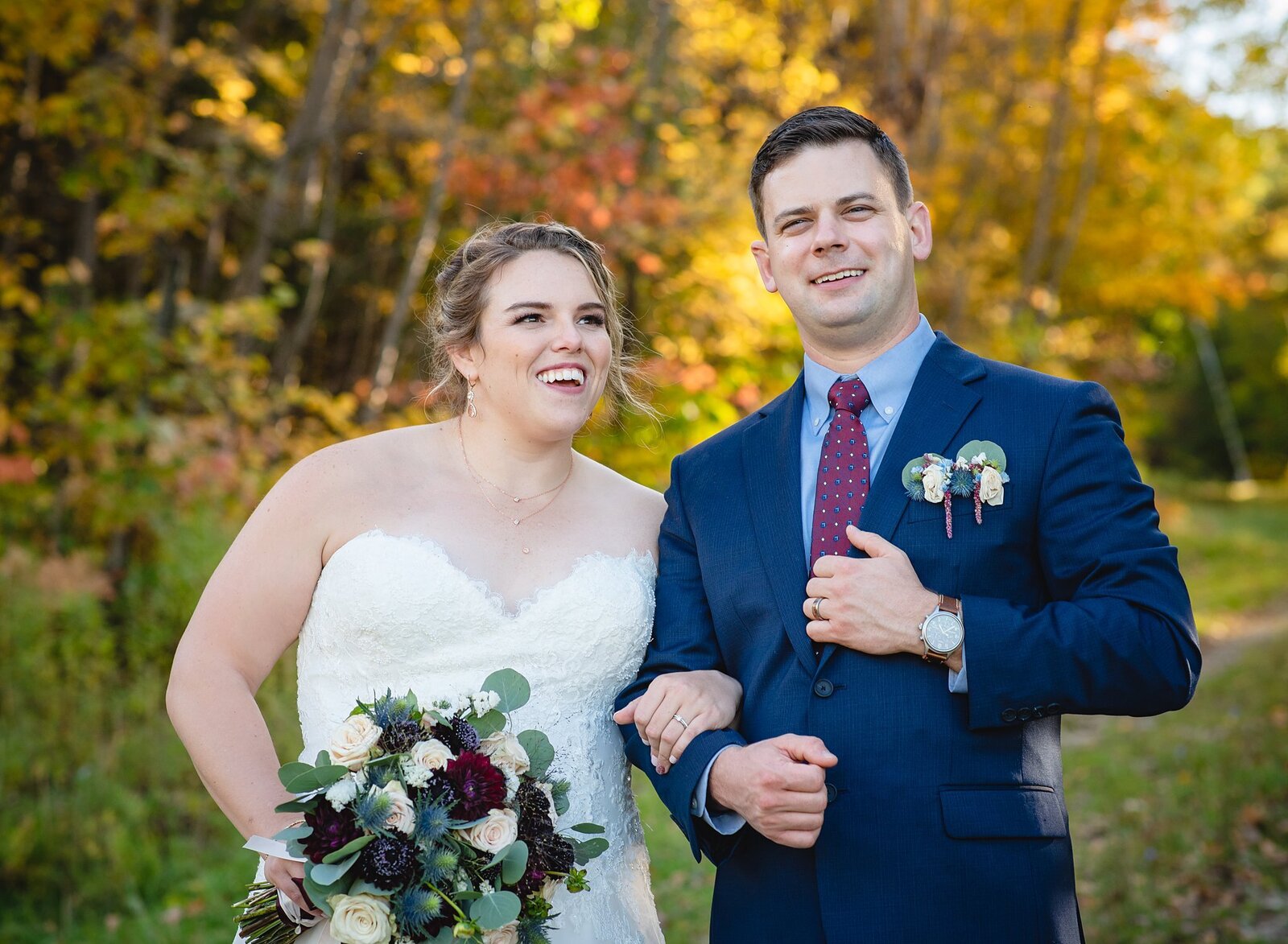 New England elopement couple walking on fall path