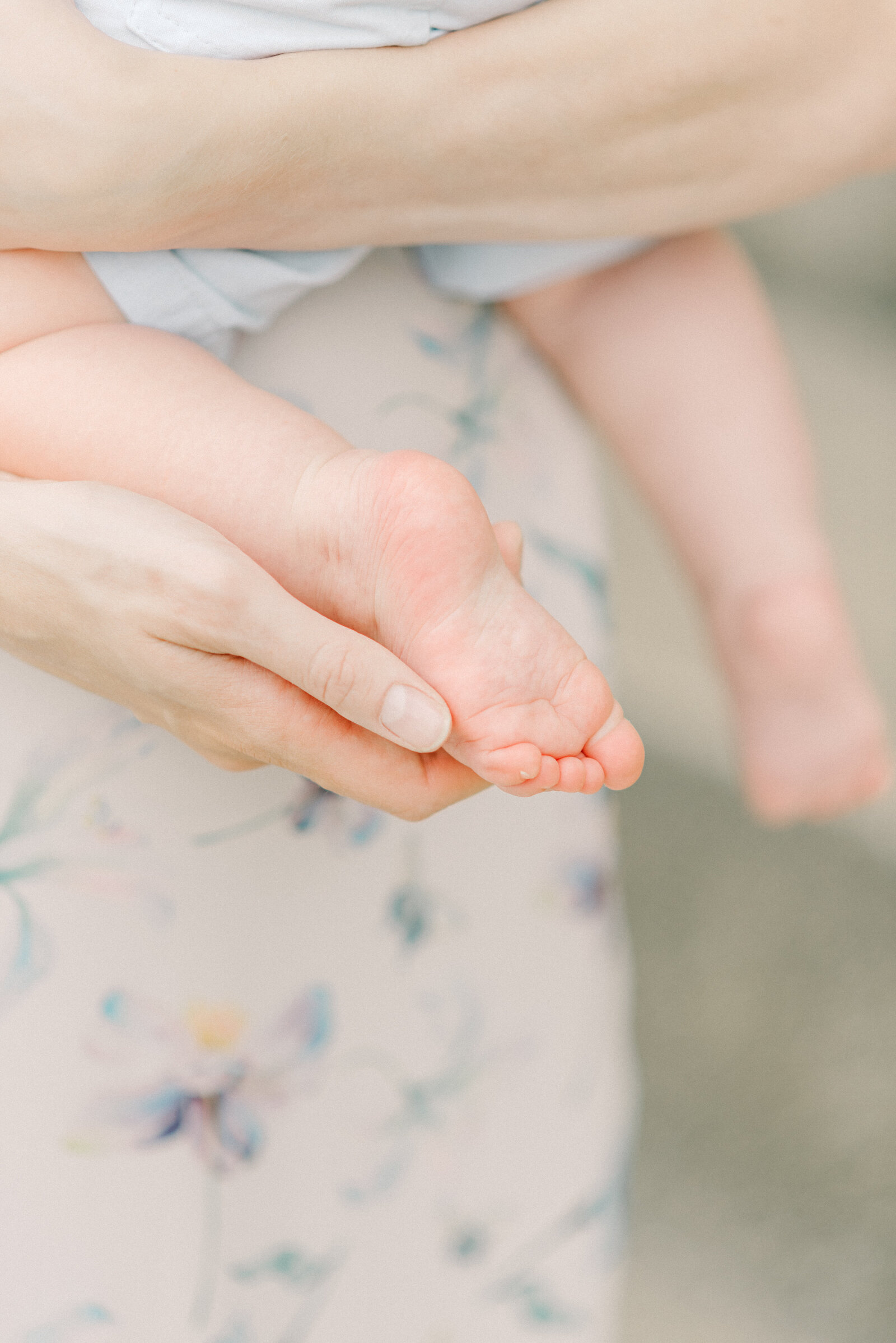 mom-holding-baby-foot