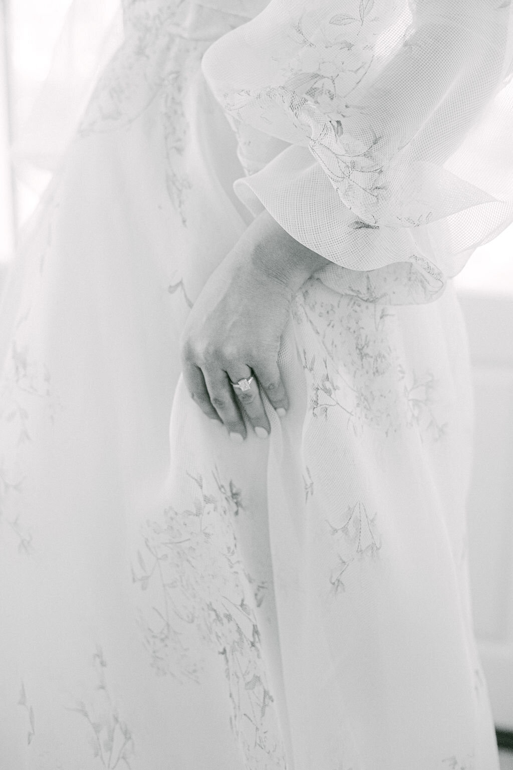 black and white photo of  Bride in a floral pattern gown for a beach wedding in Florida