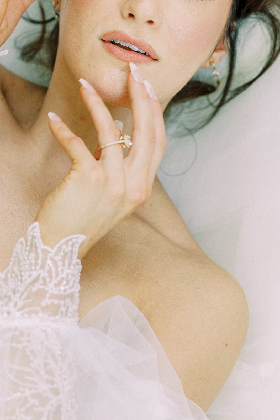 Venue3Two Grand Rapids Wedding Bride Lying on Wedding Dress close up lip shot