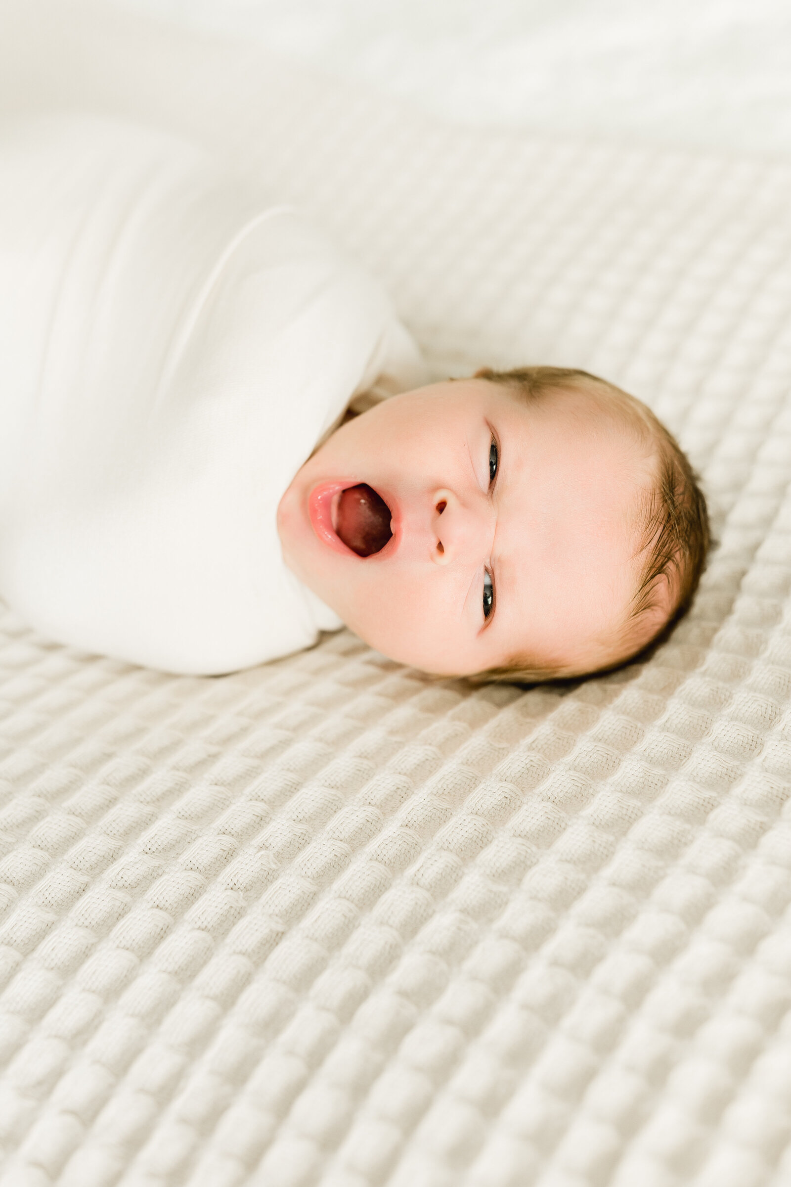 Newborn yawns during lifestyle session near Birmingham