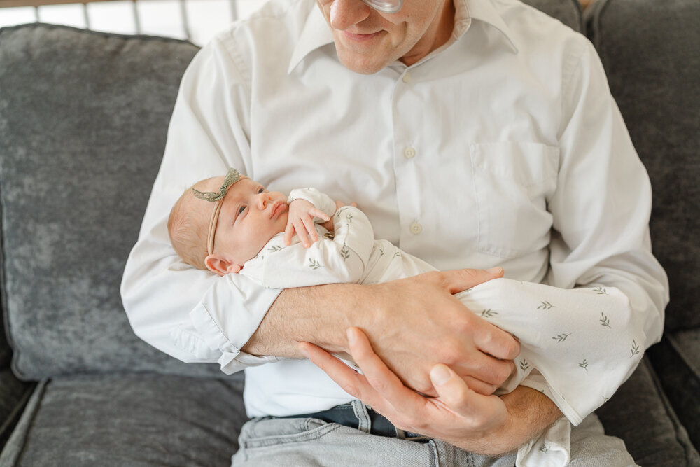 close up of dad holding baby during newborn photo, McLean, Virginia