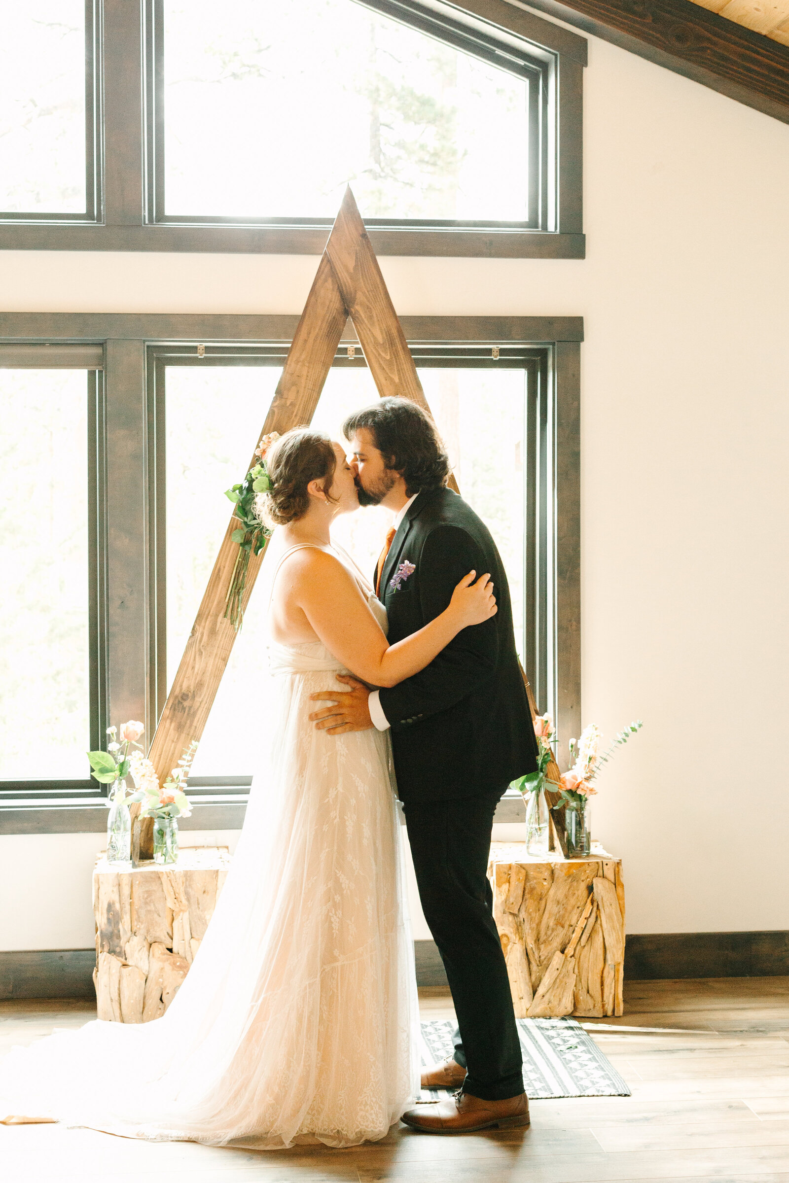A couple celebrates their intimate elopement at a cabin at Big Bear Lake, California.