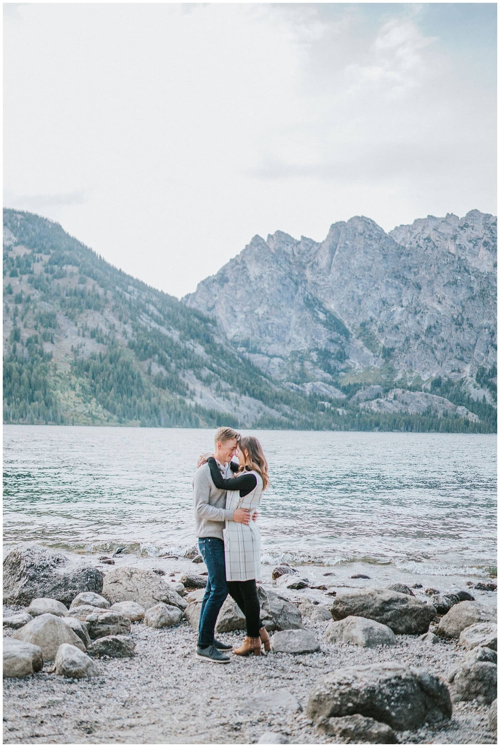 Sacramento Wedding Photographer captures couple embracing lakeside during engagement photos