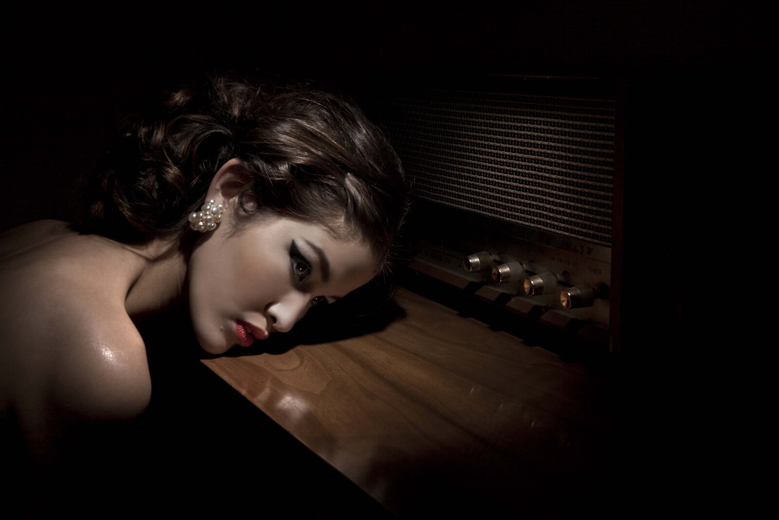 Makeup for model resting on furniture