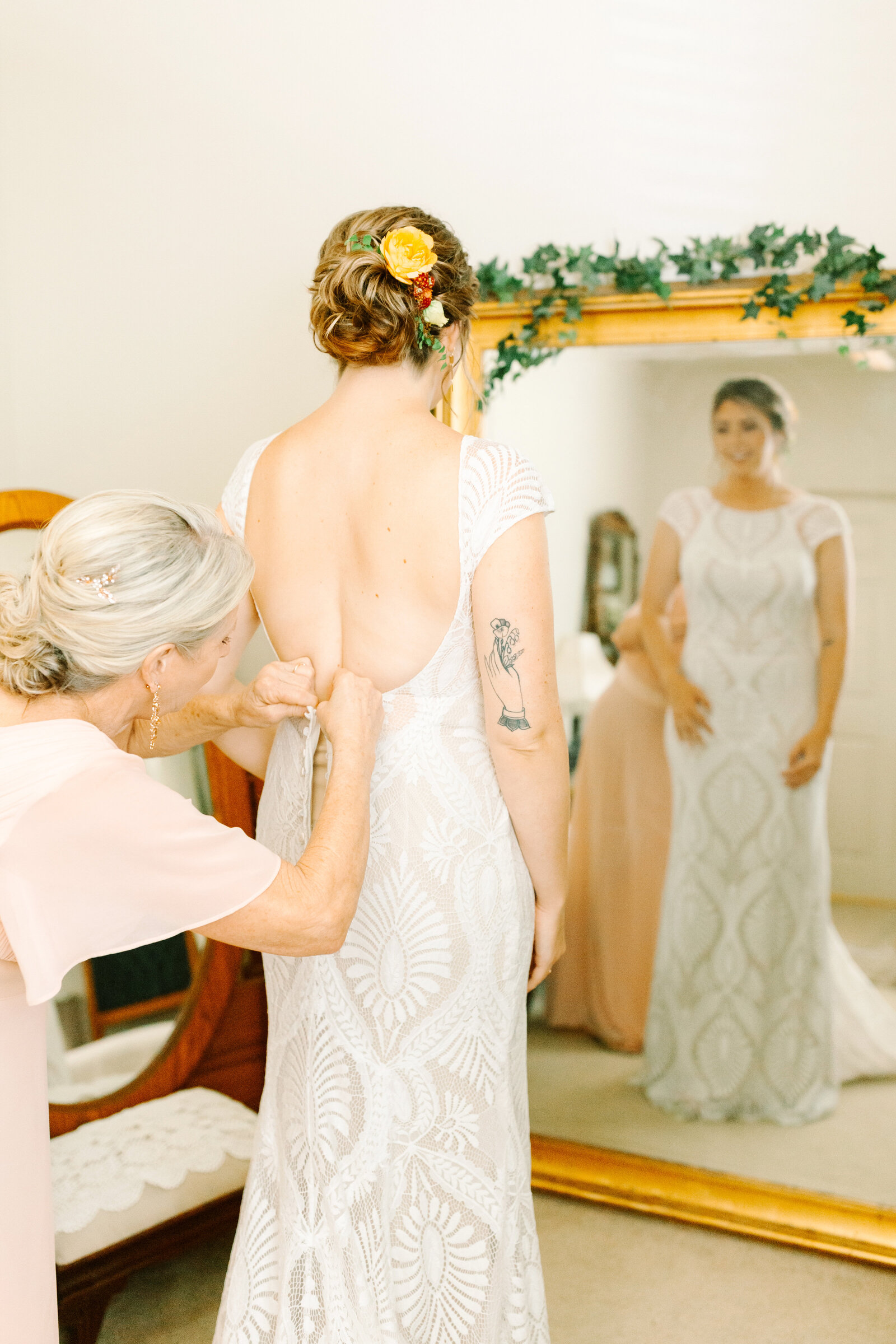 Bride getting ready on her colorful wedding day in Santa Cruz, California in the redwood trees.