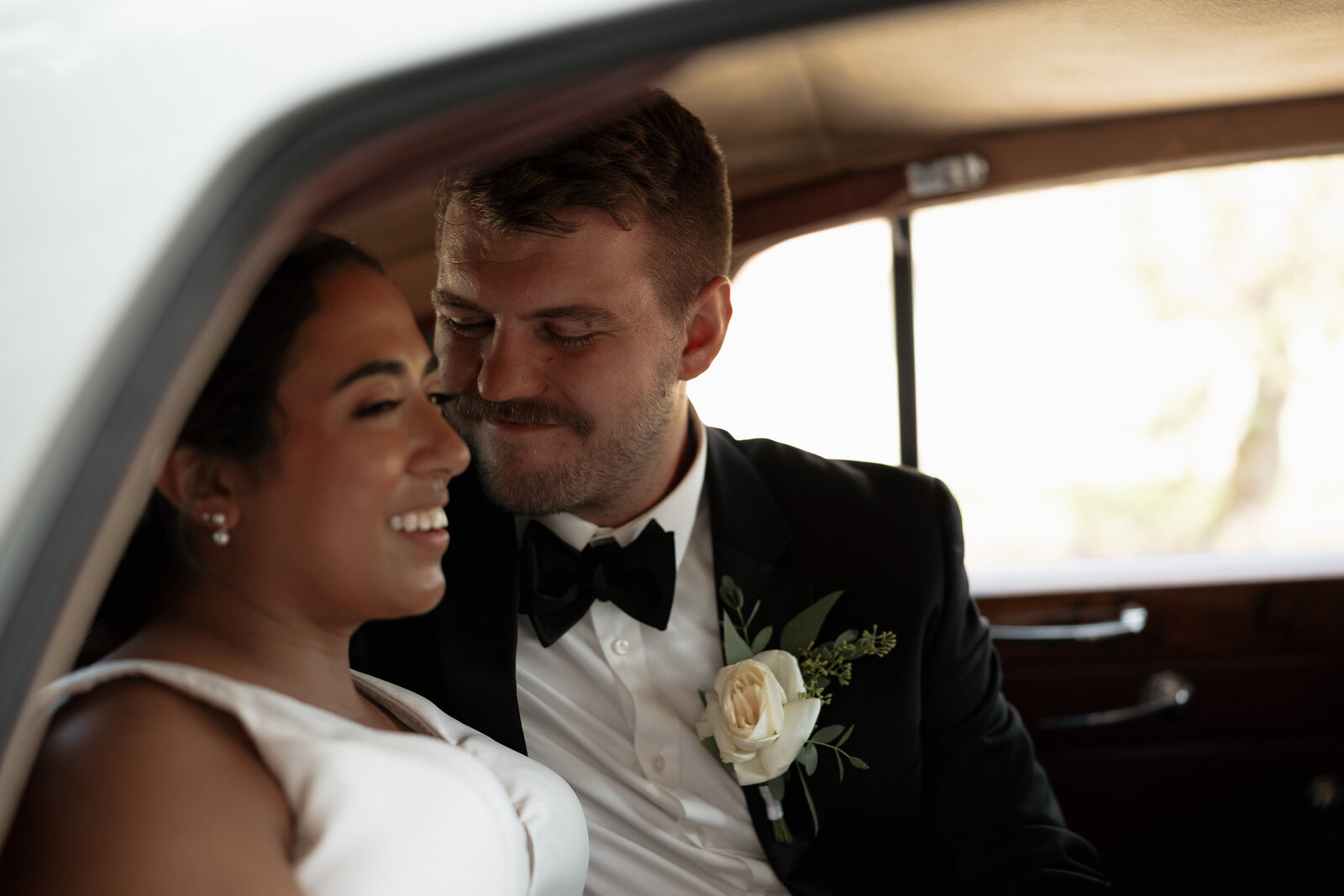 Wild Carrot Stlouis Wedding couple portrait in old vintage car