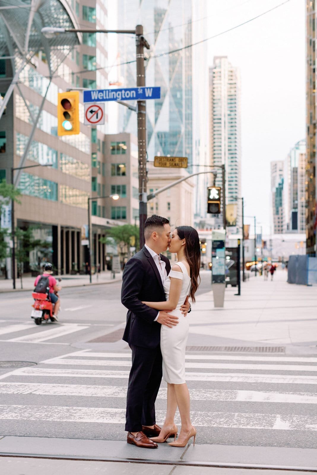 Modern Couple Walking around financial district downtown toronto engagement session toronto wedding photographer jacqueline james photography