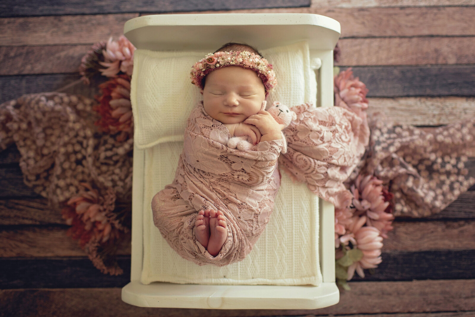 baby-girl-with-pink-flowers