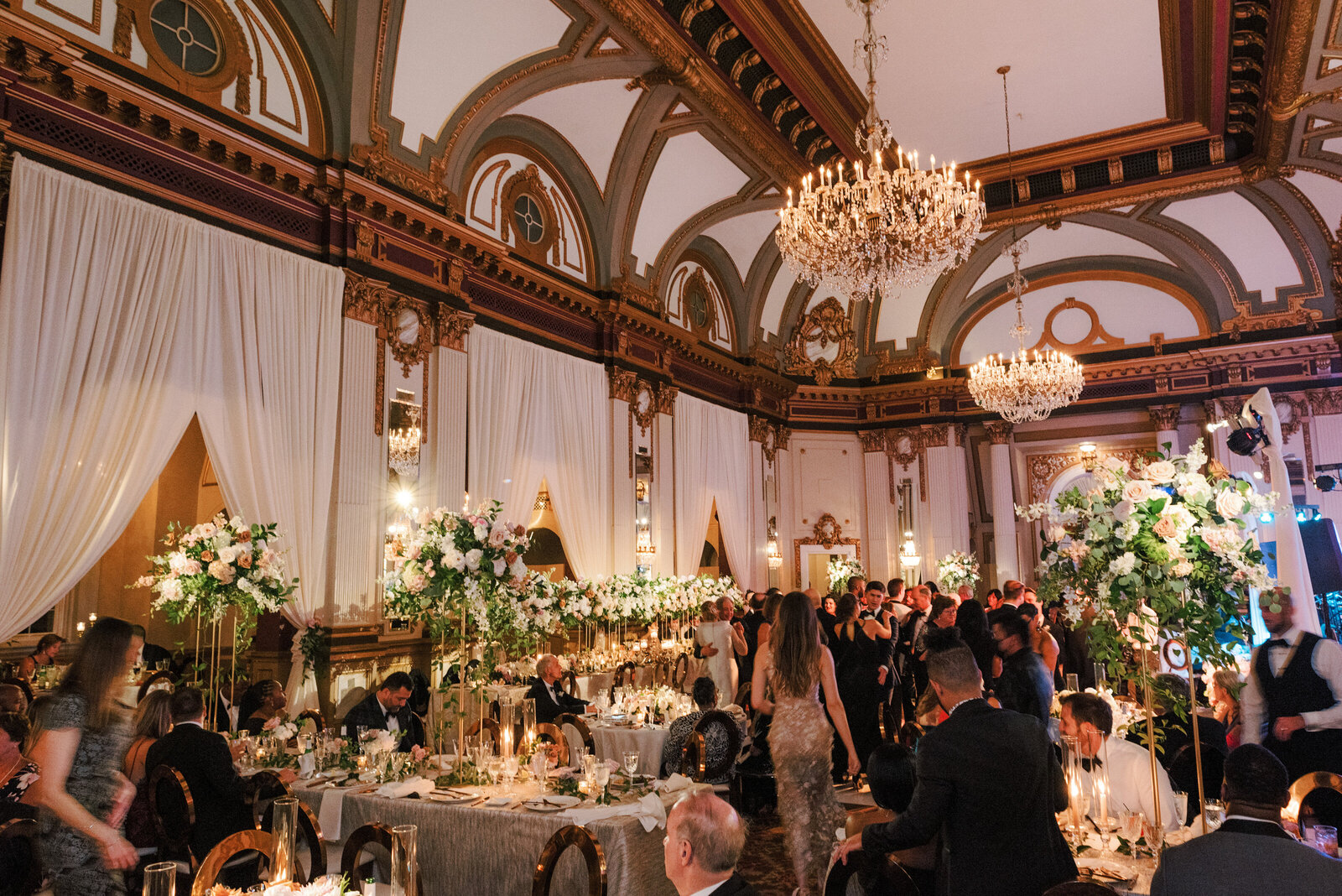 Historic ballroom wedding design in Baltimore with tall floral centerpieces