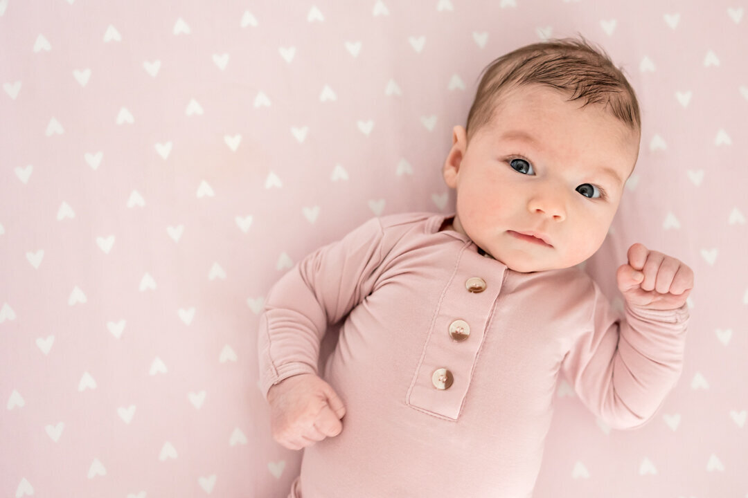 Baby girl in dusty pink gown