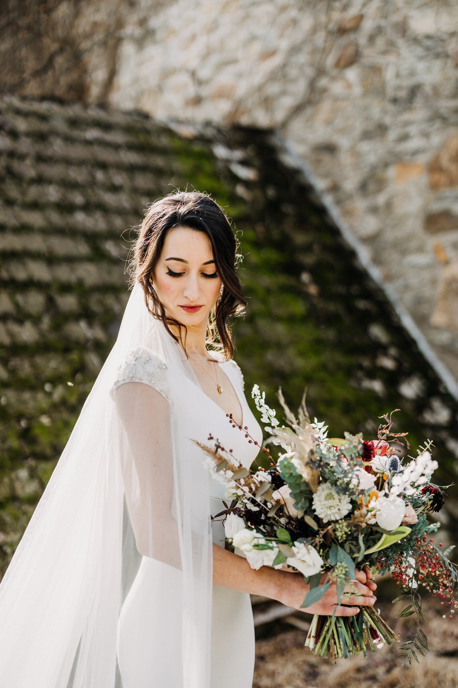 bride with modern dress and flower bouquet