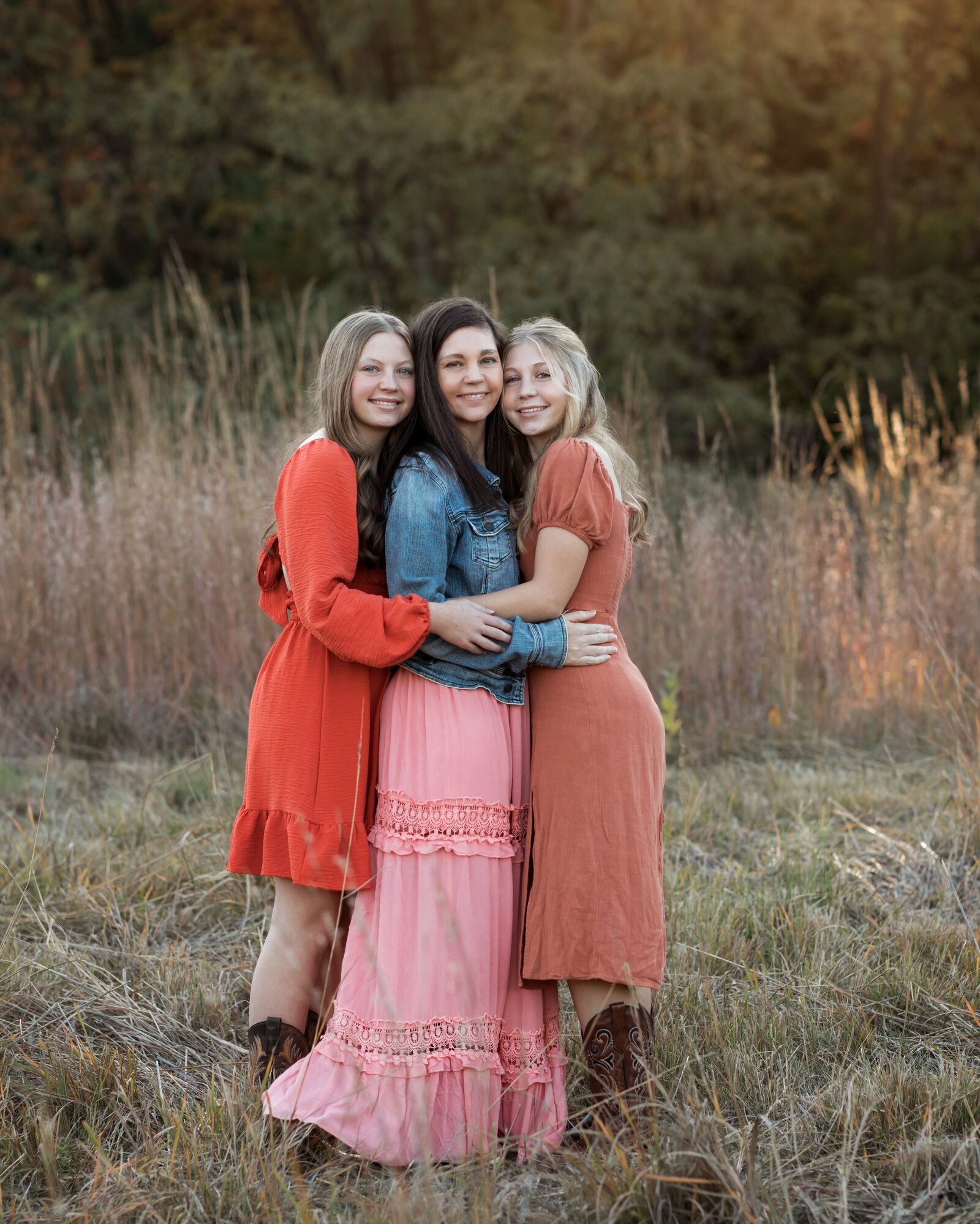 mom and two daughters hugging for family photos at westcreek reservation cleveland family photography