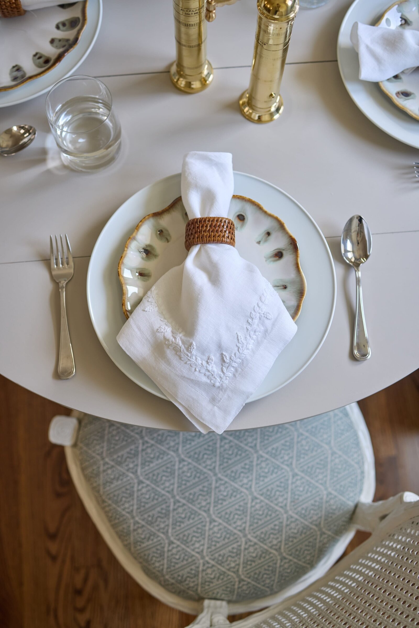 vision and hammer dining room table with plate setting and wooden napkin holder