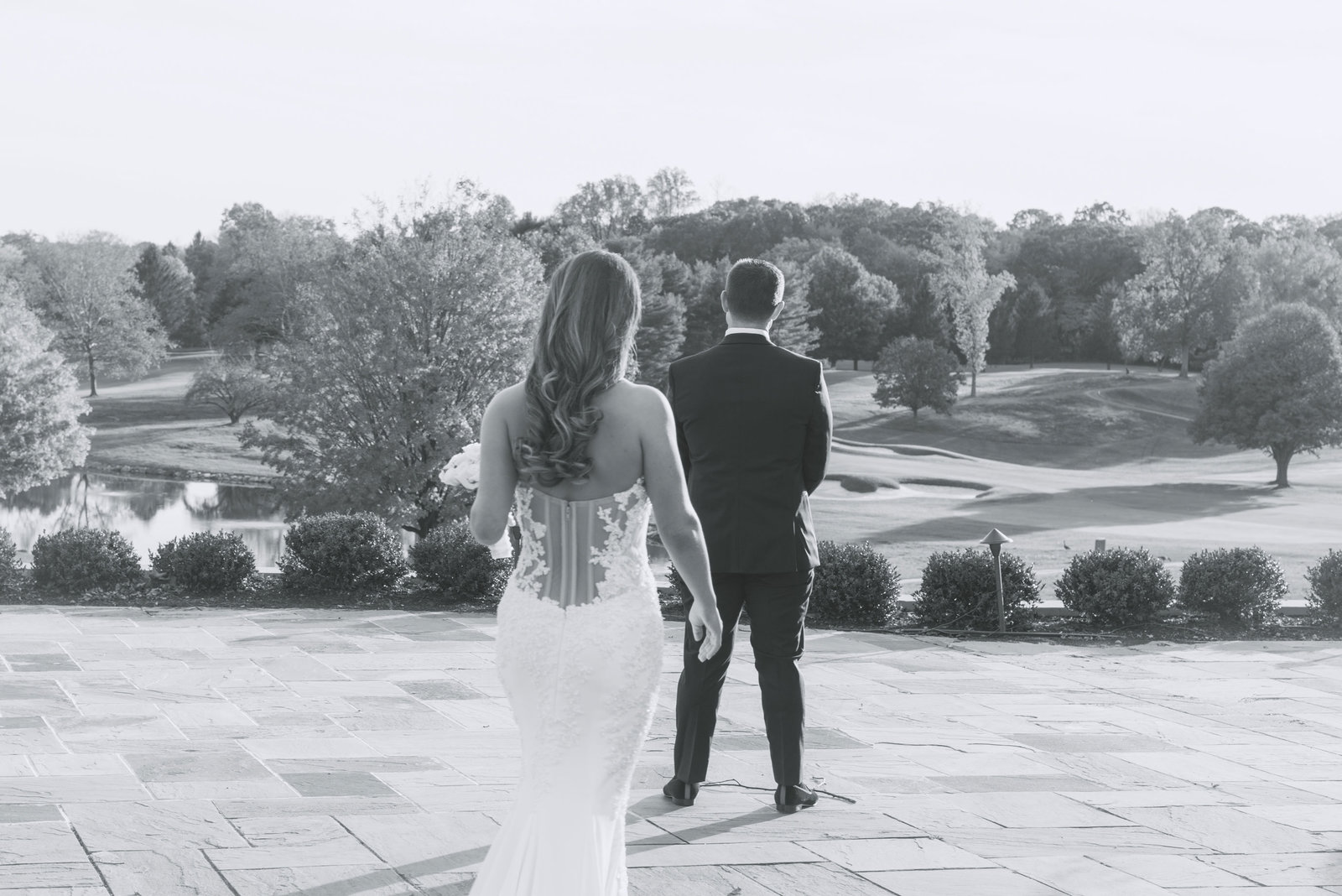 bride walking to first look at Glen Head Country Club