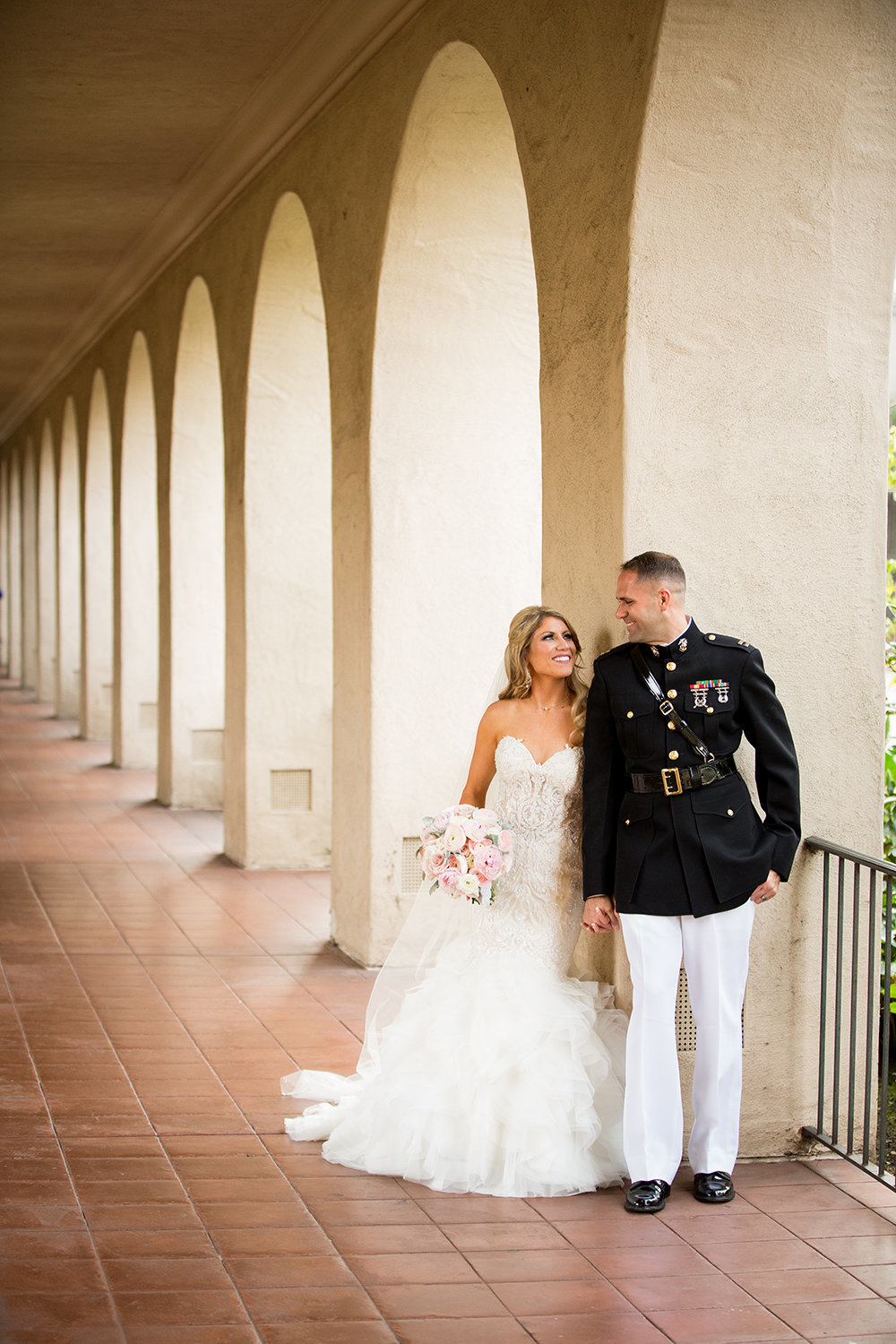 bride in groom in balboa park for their prado wedding