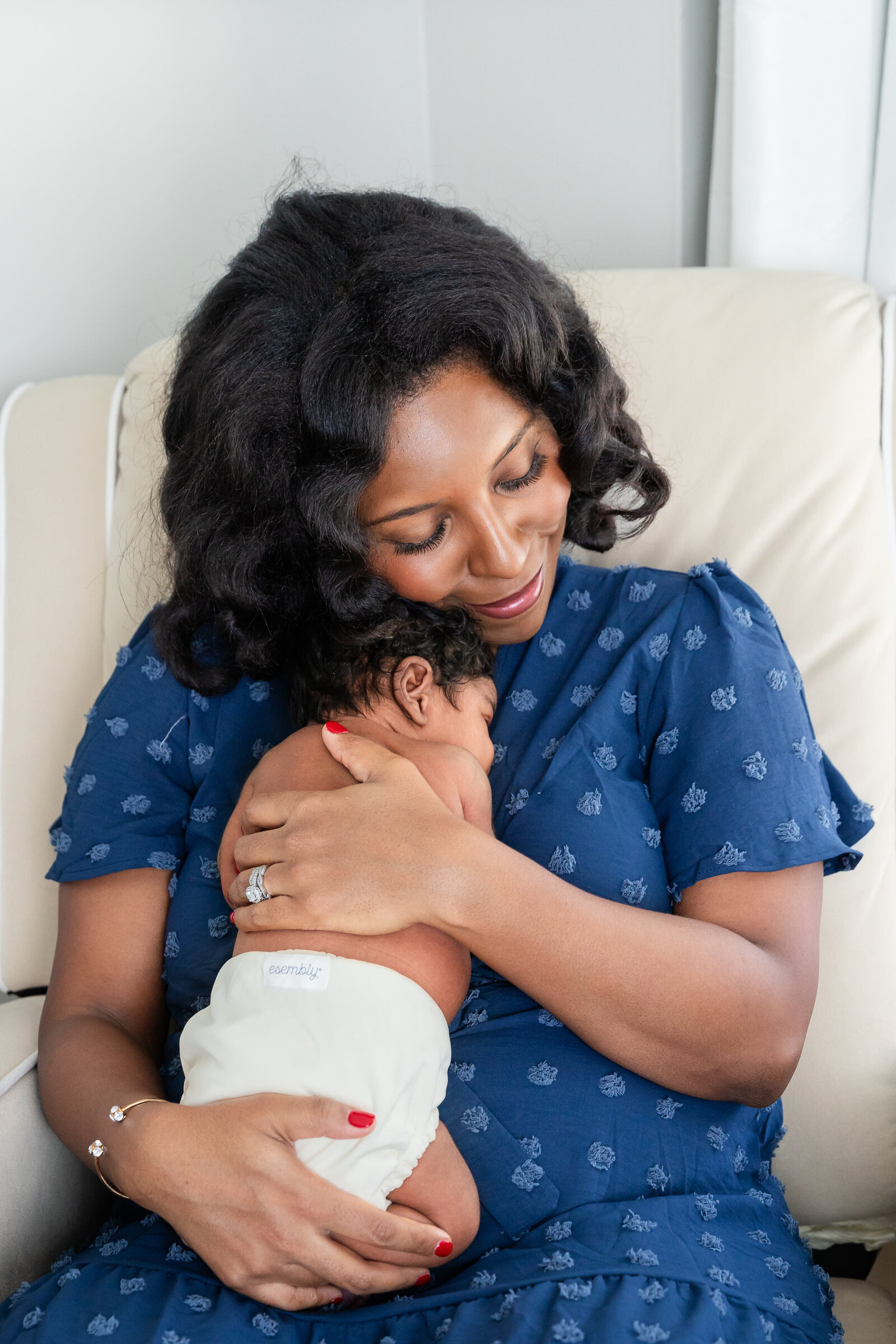 mom-holding-bab-new-jersey-newborn-photographer