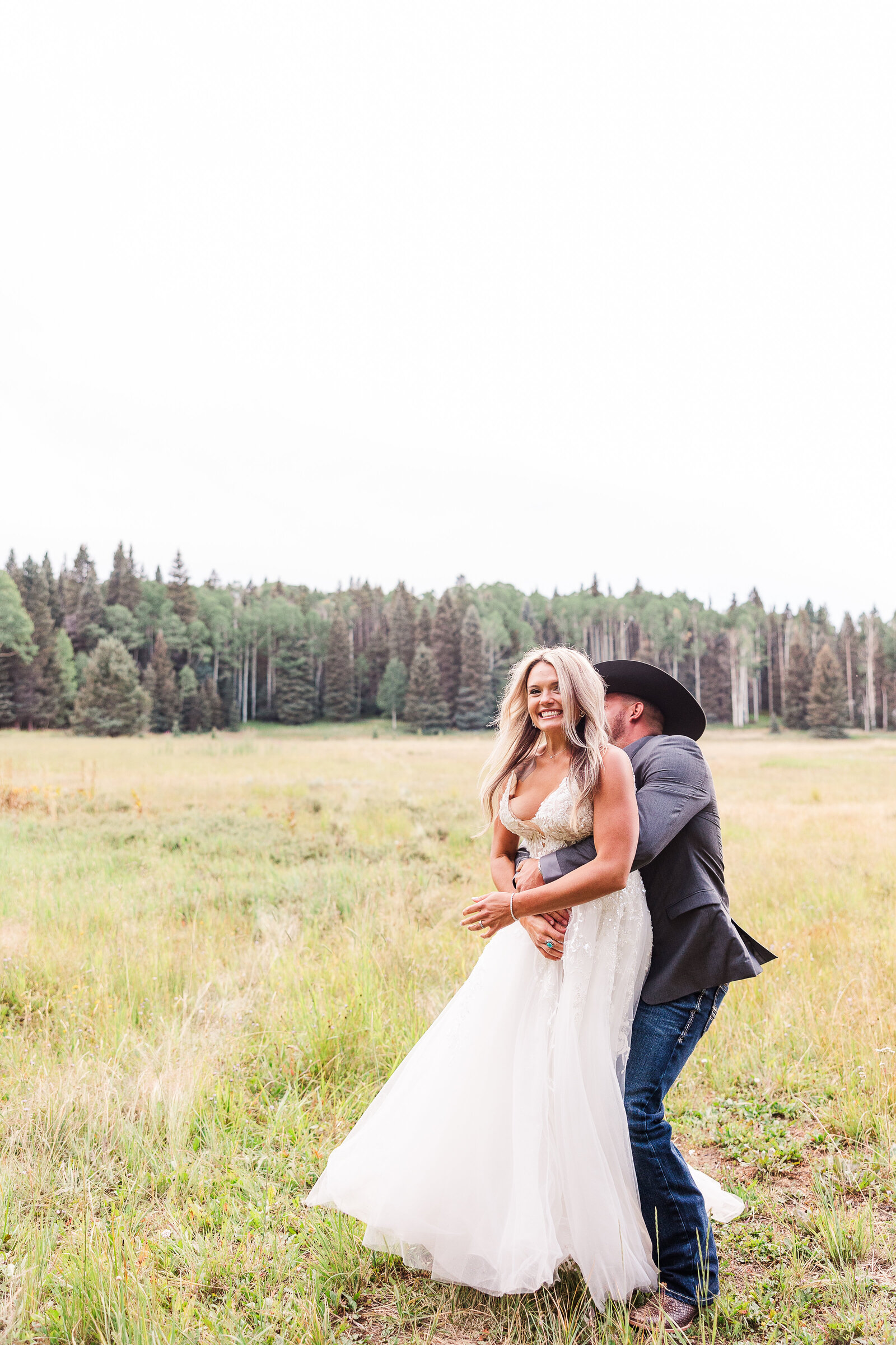 Bride gets grabbed from groom in this playful prompt 