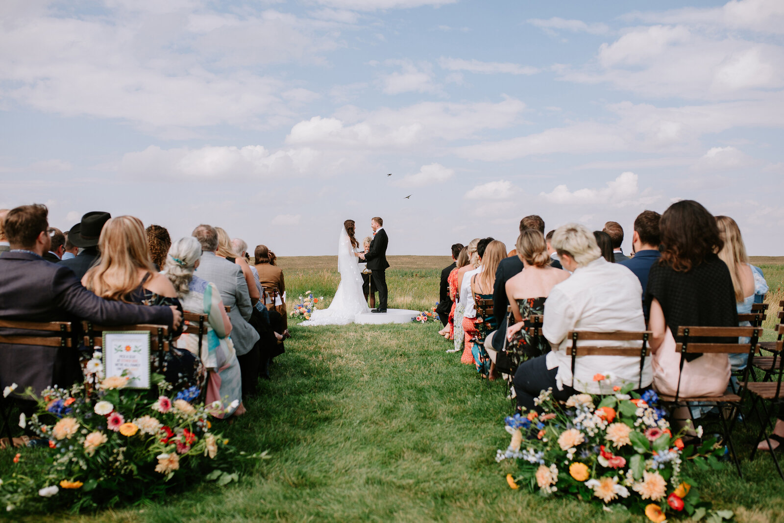 A bride and groom exchange vows at The Gathered in Calgary, Alberta