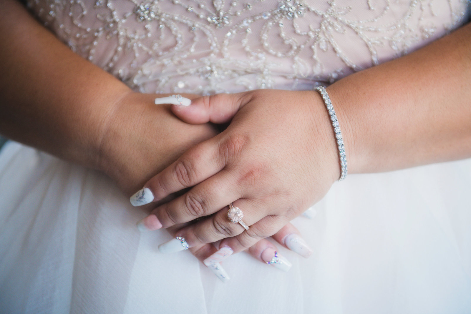 close up photo of brides hands with rings and accessories from wedding at Sea Cliff Manor
