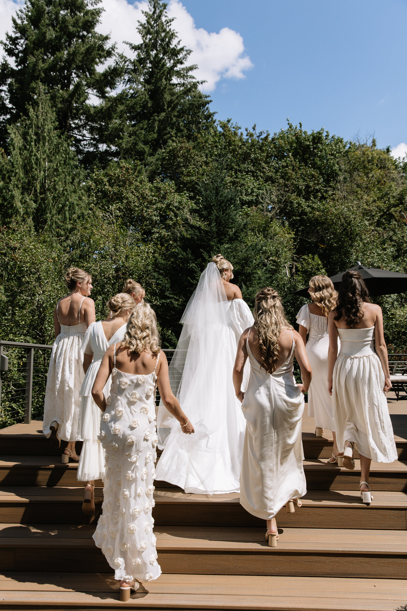 Bridesmaids walking up stairs taken in Washington by elopement photographer, Erica Rochelle