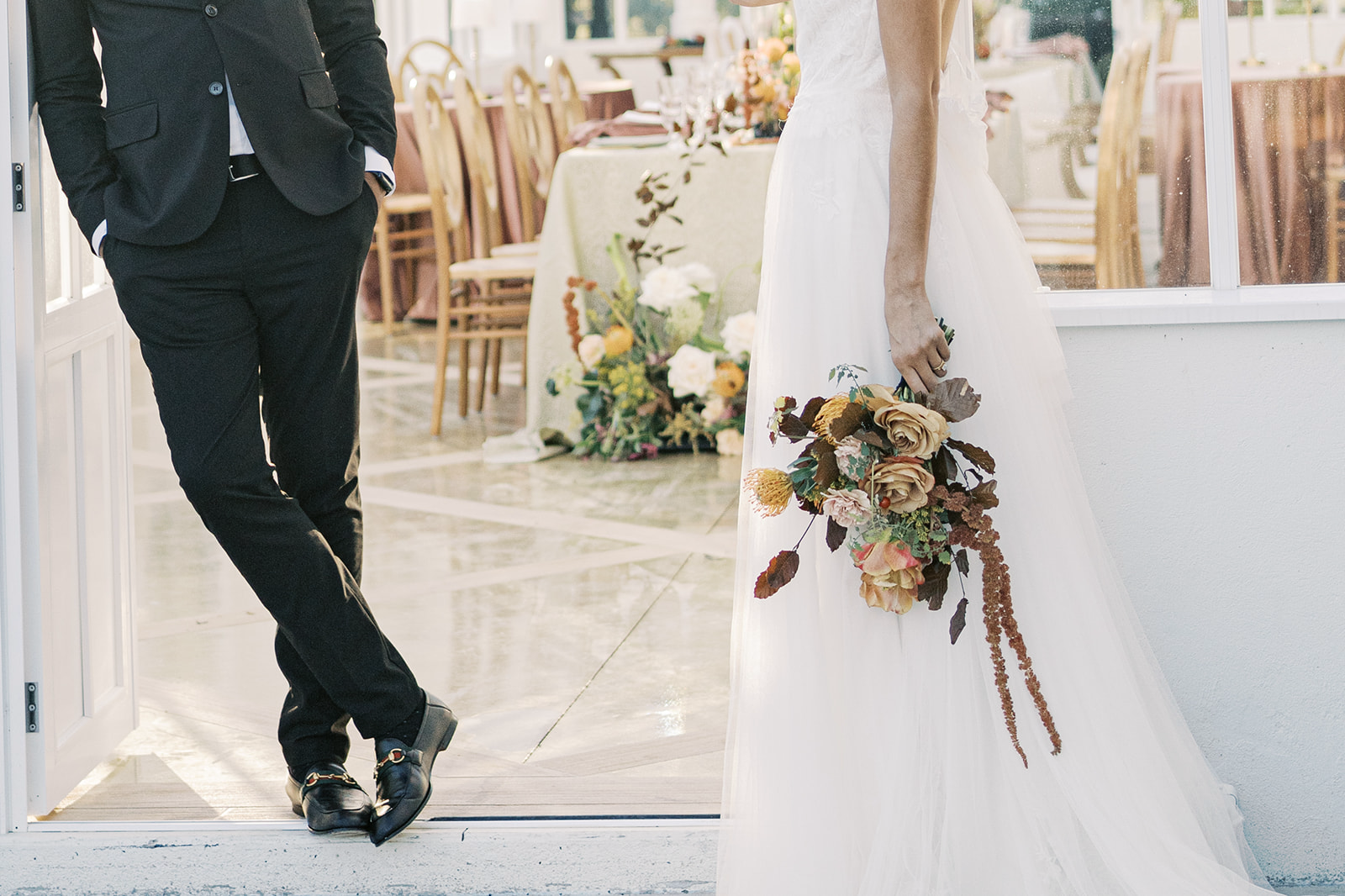 The bride and groom side by side looking at each other before the start of their reception | Megan Smith Photography