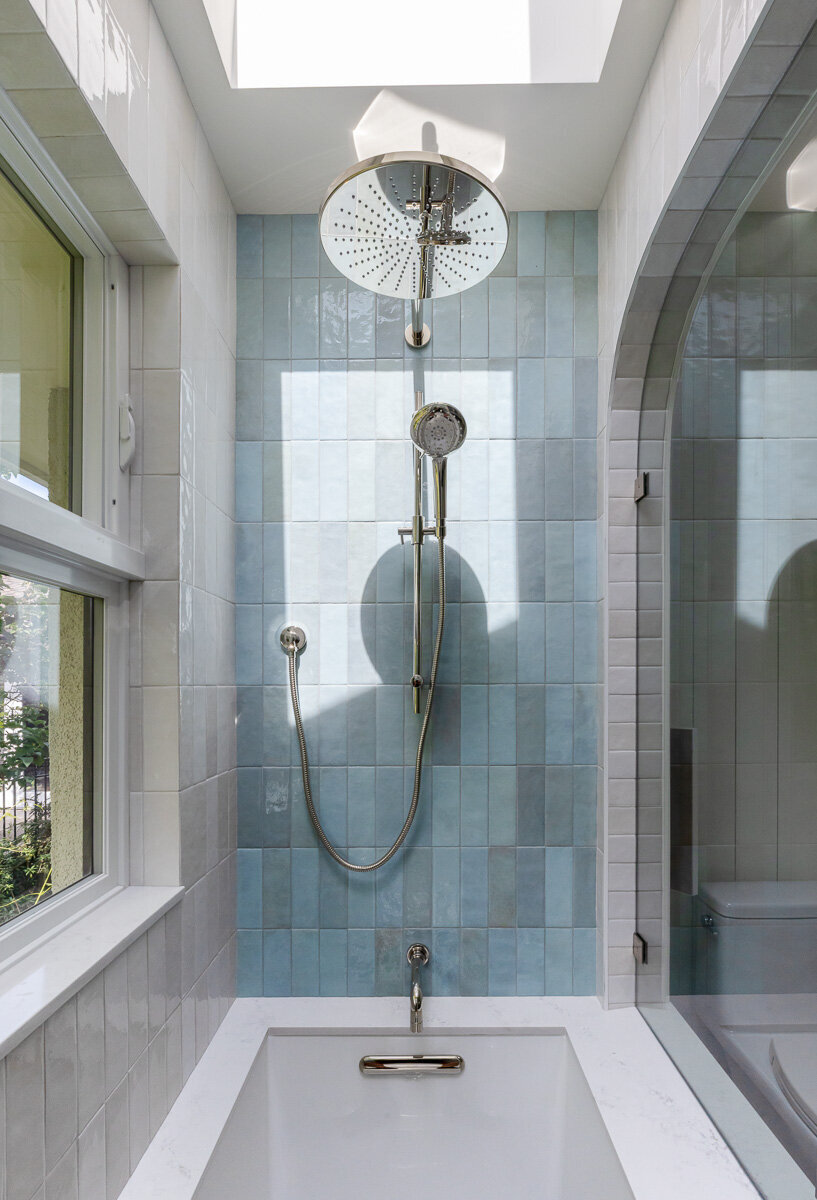 blue-tiles-in bathtub-with-skylight