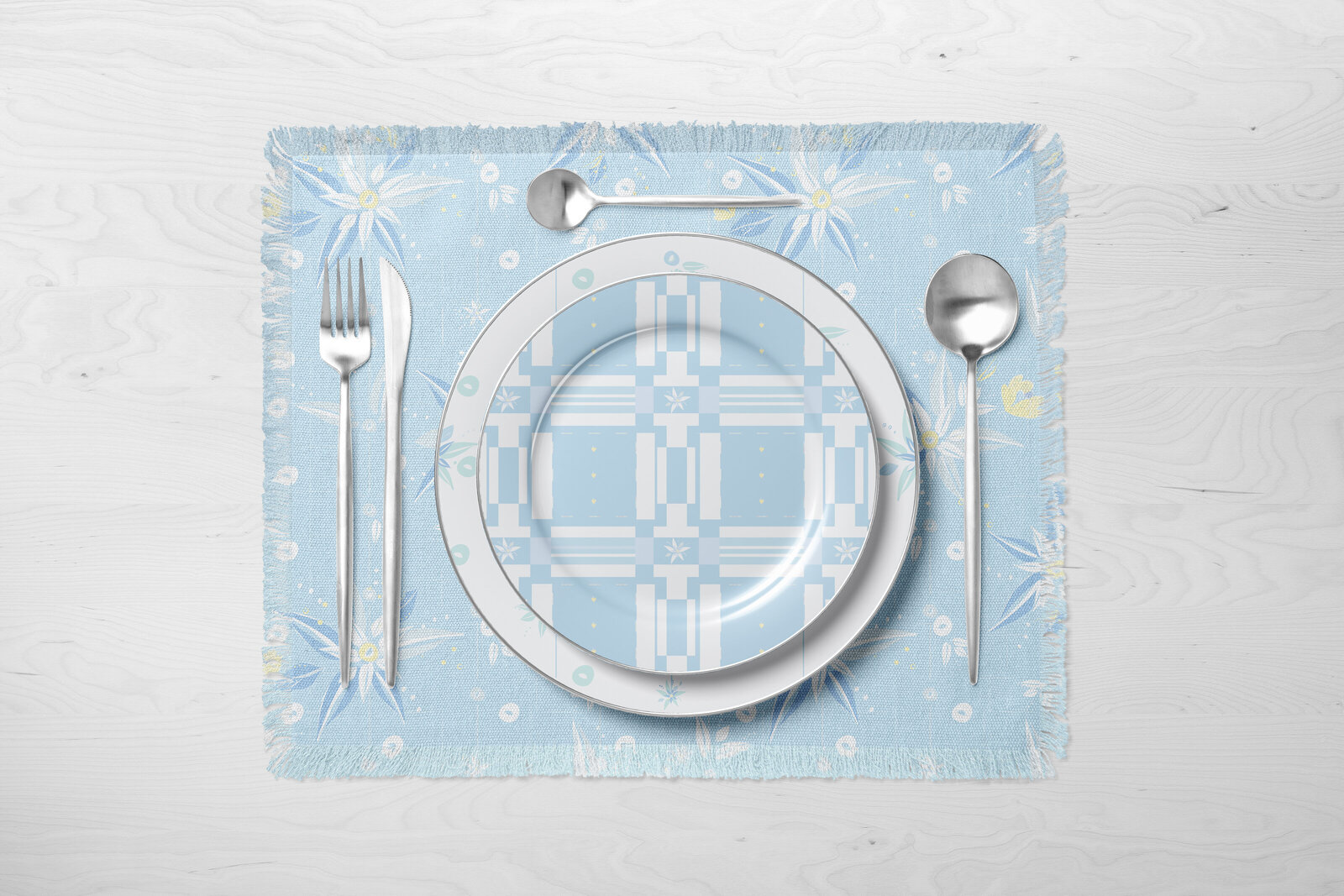 blue and white patterned placemat and dinner plates