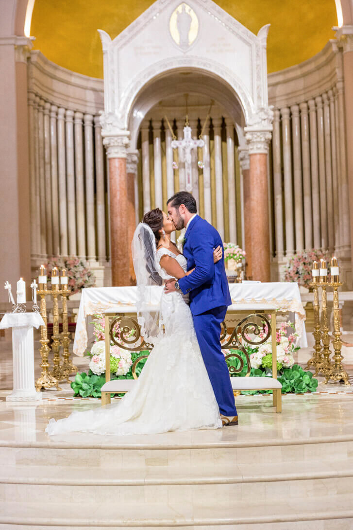 newlywed-first-kiss-catholic-wedding-ceremony-miami-beach-21