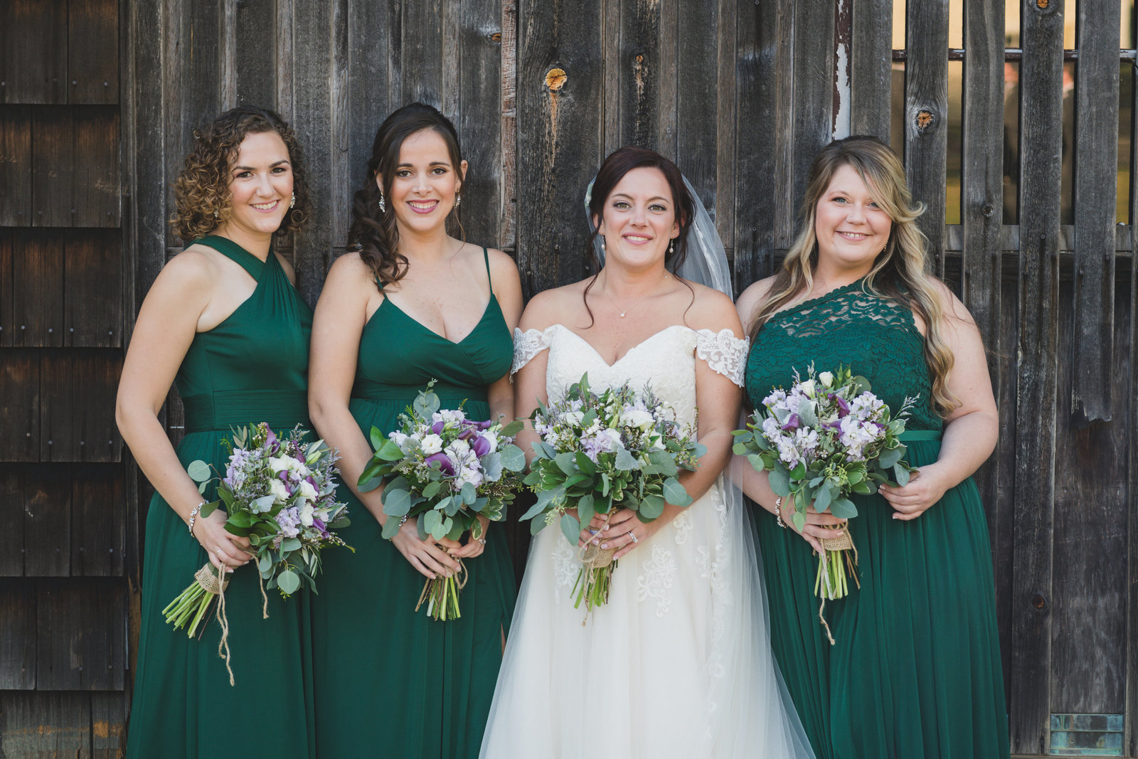 bridesmaid and bride at the barn at old bethpage wedding