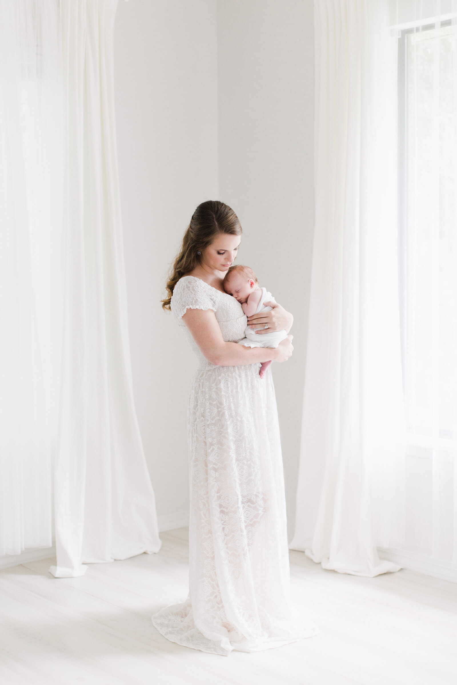 Mom with baby in Bentonville newborn photography studio