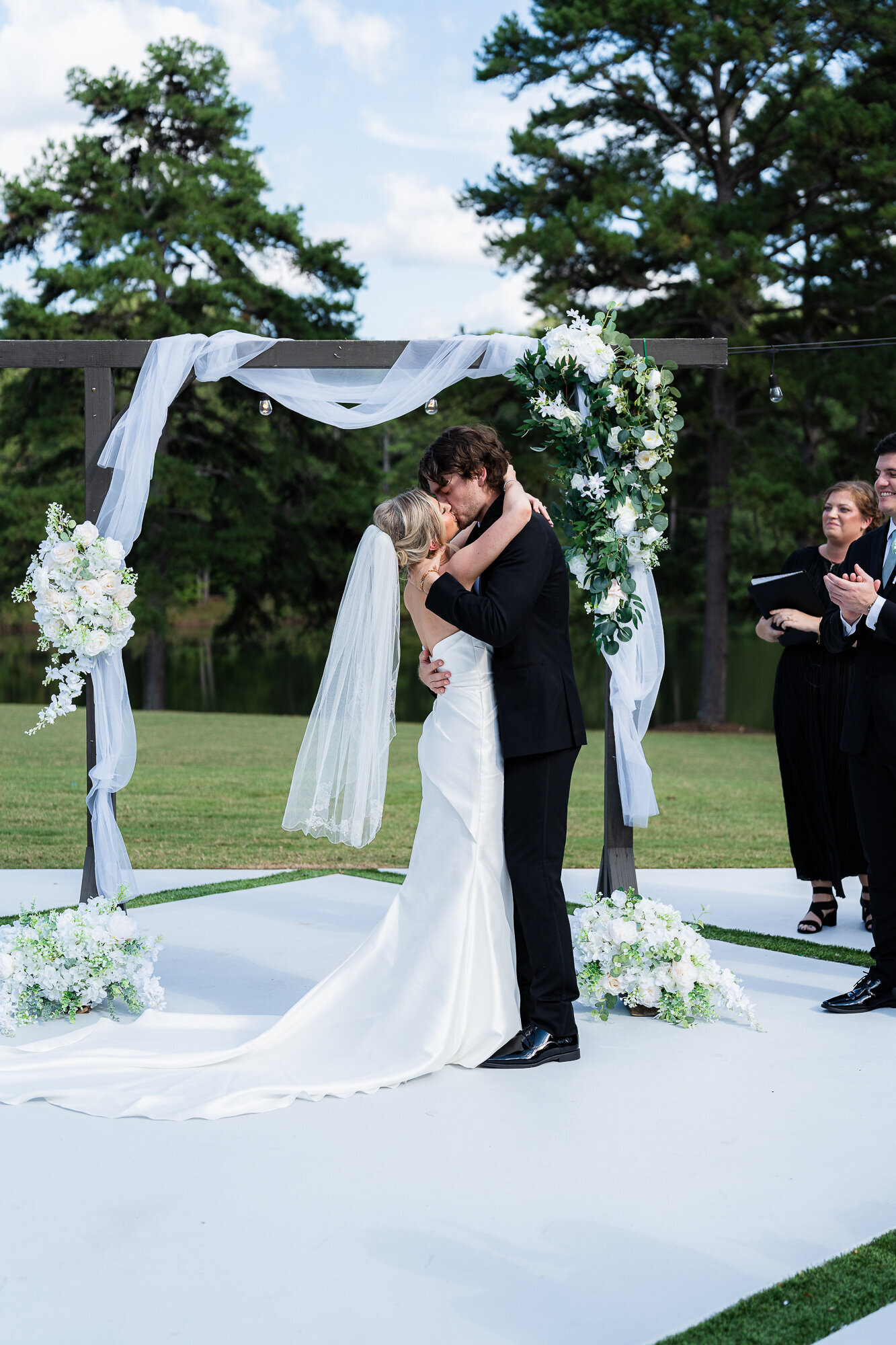 bride and groom kissing for the first time as husband and wife at the wedding ceremony at the Venue Daisy Hill wedding venue 