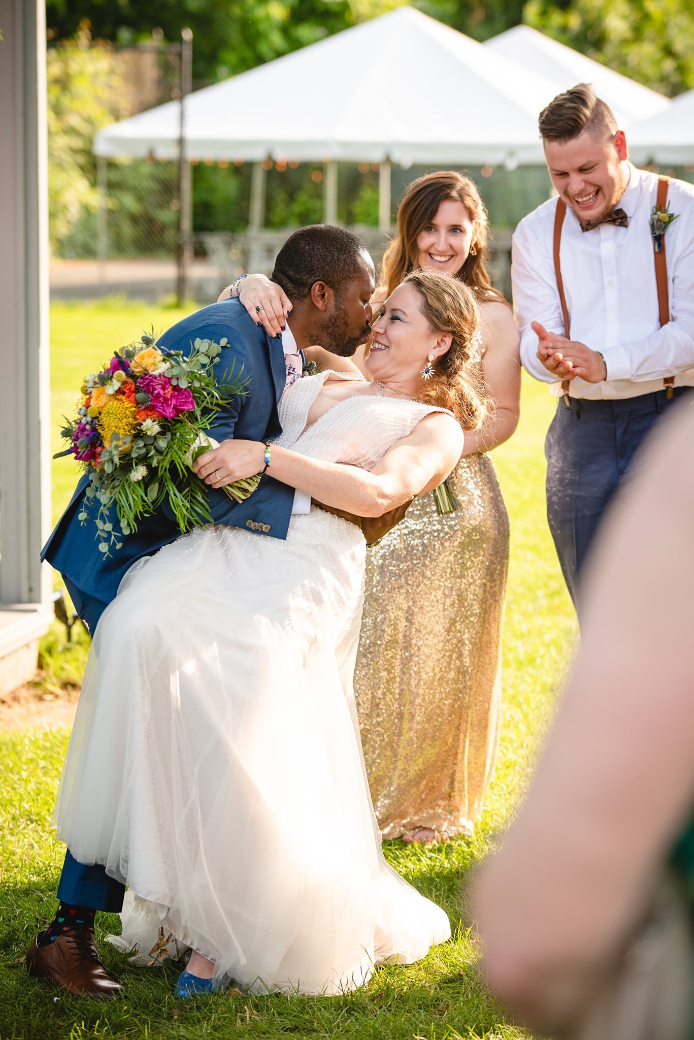 couple kissing at intimate backyard wedding