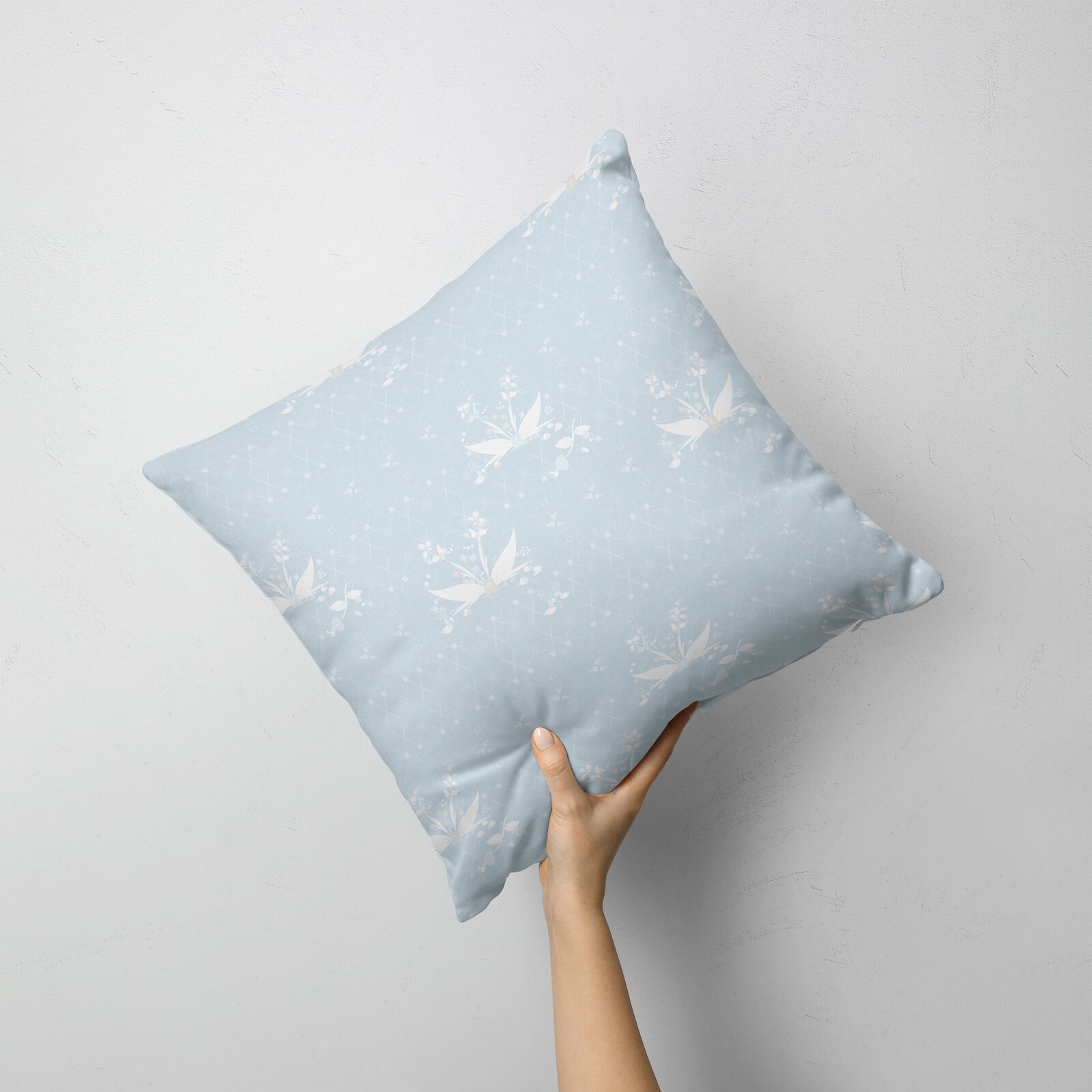 blue and white patterned pillow