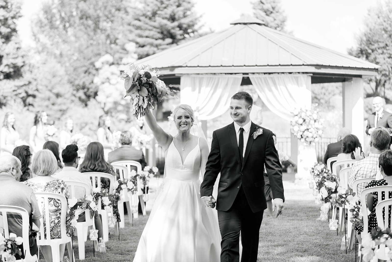 Walking down the aisle at wedding ceremony in Boise taken by the Best Boise Wedding Photographers