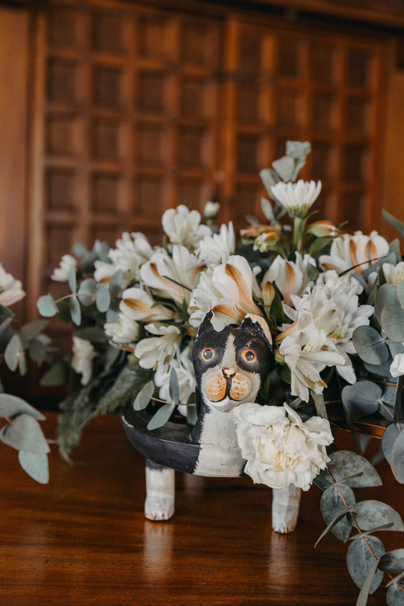 floral arrangement with dog ornament