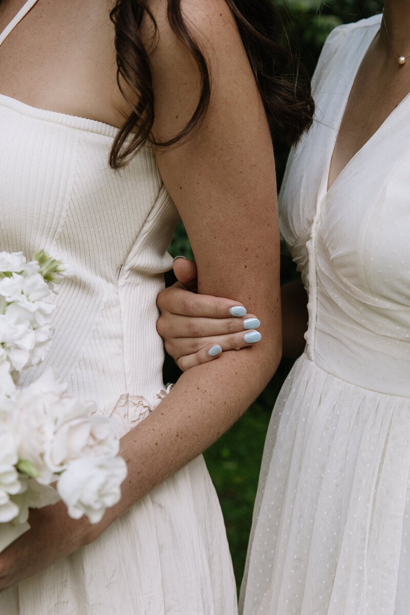 Brides linking arms taken by washington elopement photographers