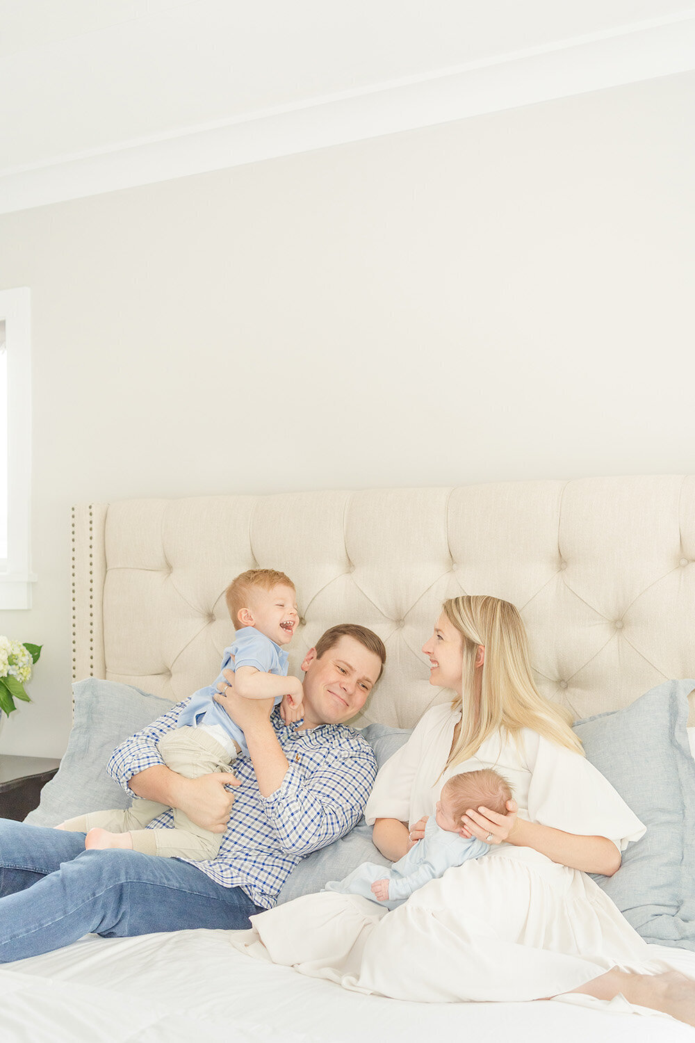 family playing during newborn picture in McLean, Virginia