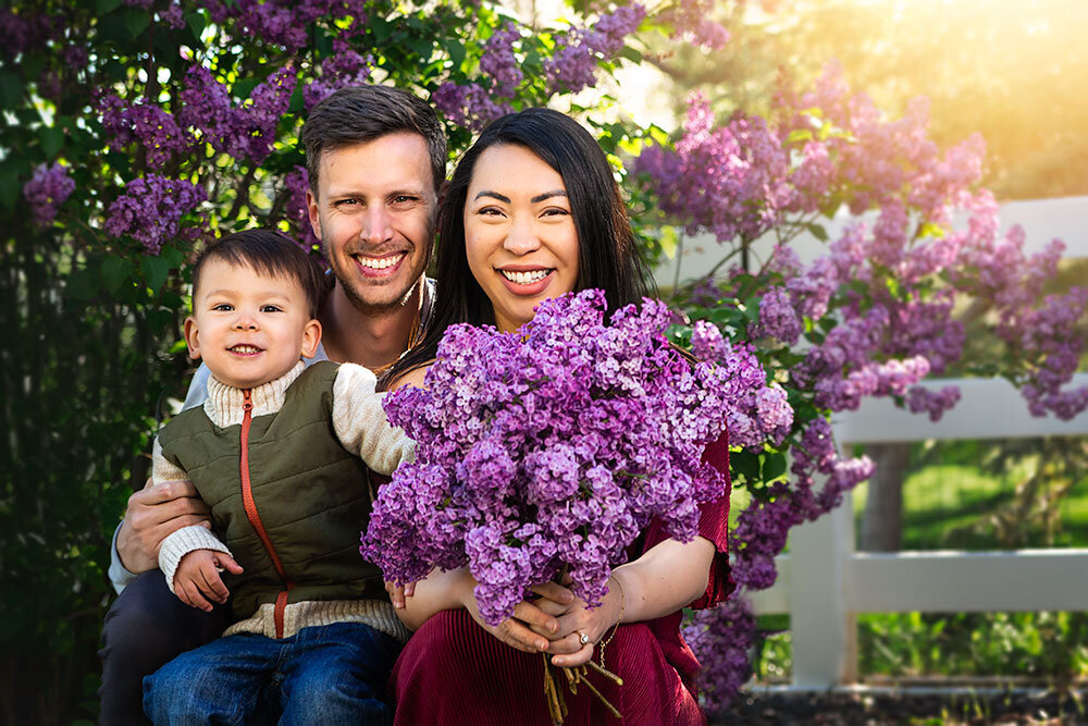 loving-sweet-adorable-family-of-three-boy-mom-pregnant-dad-flowers-spring-lilacs