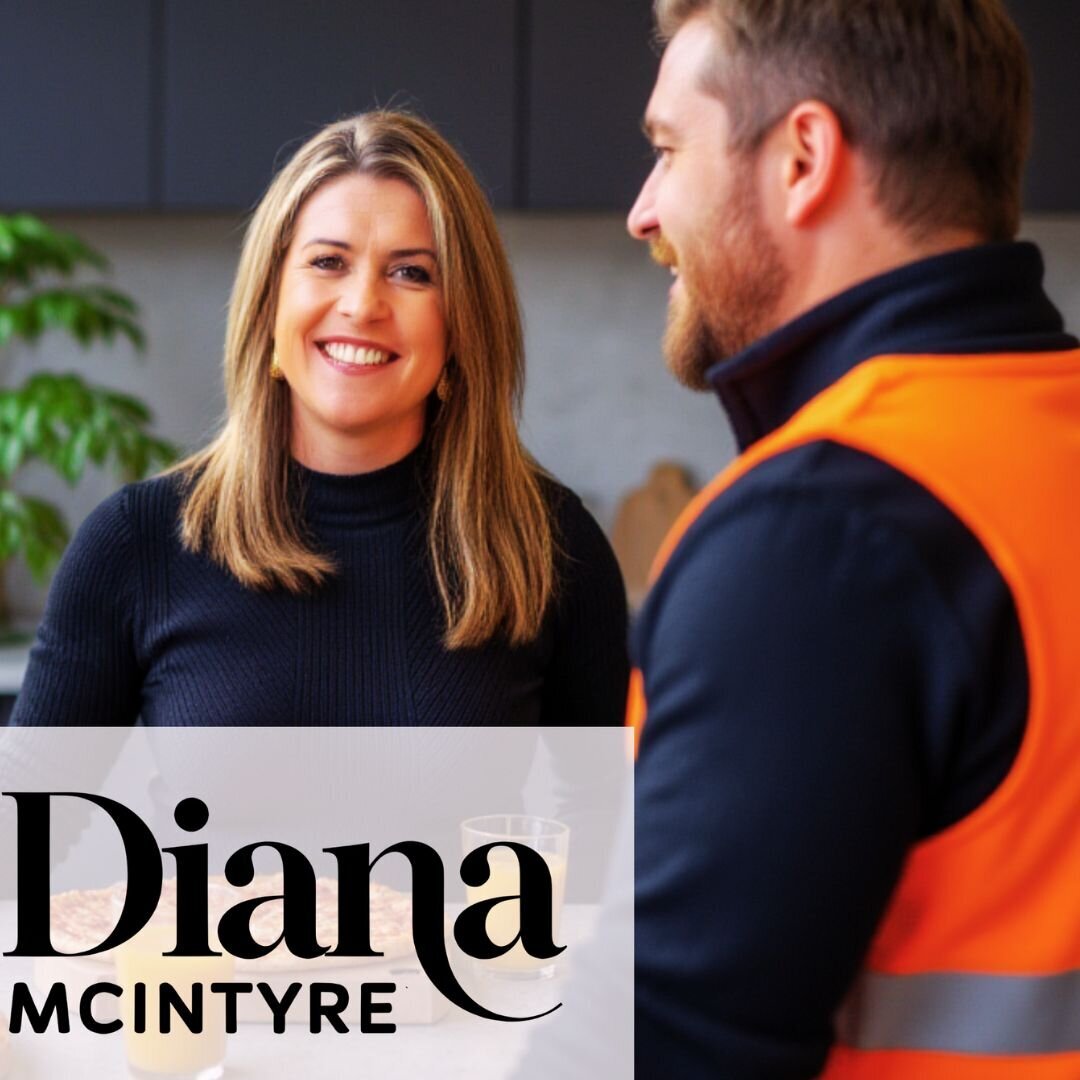 Lifestyle image of insurance adviser Diana McIntyre in a kitchen with business client,