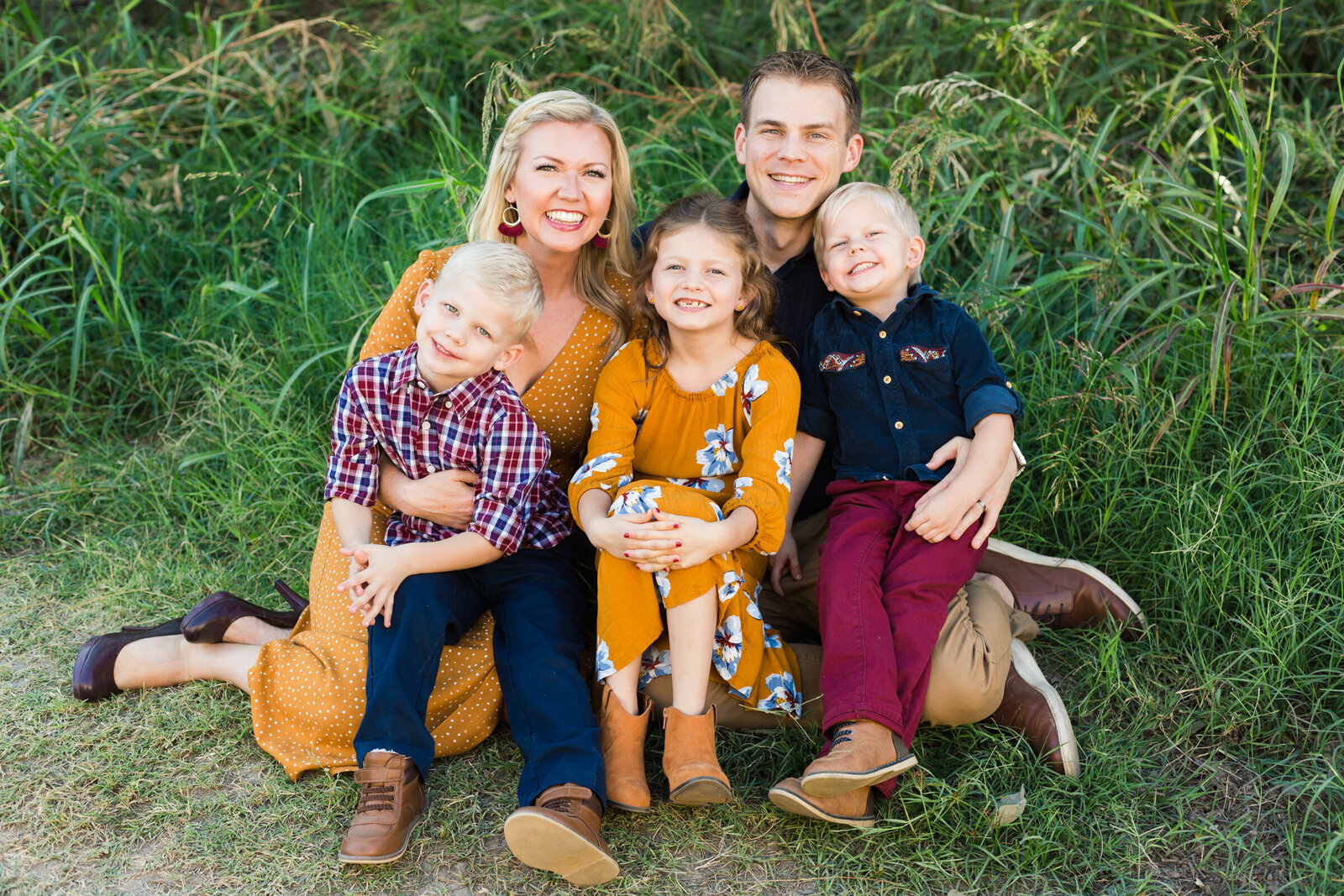 Scottsdale Family sitting and smiling together