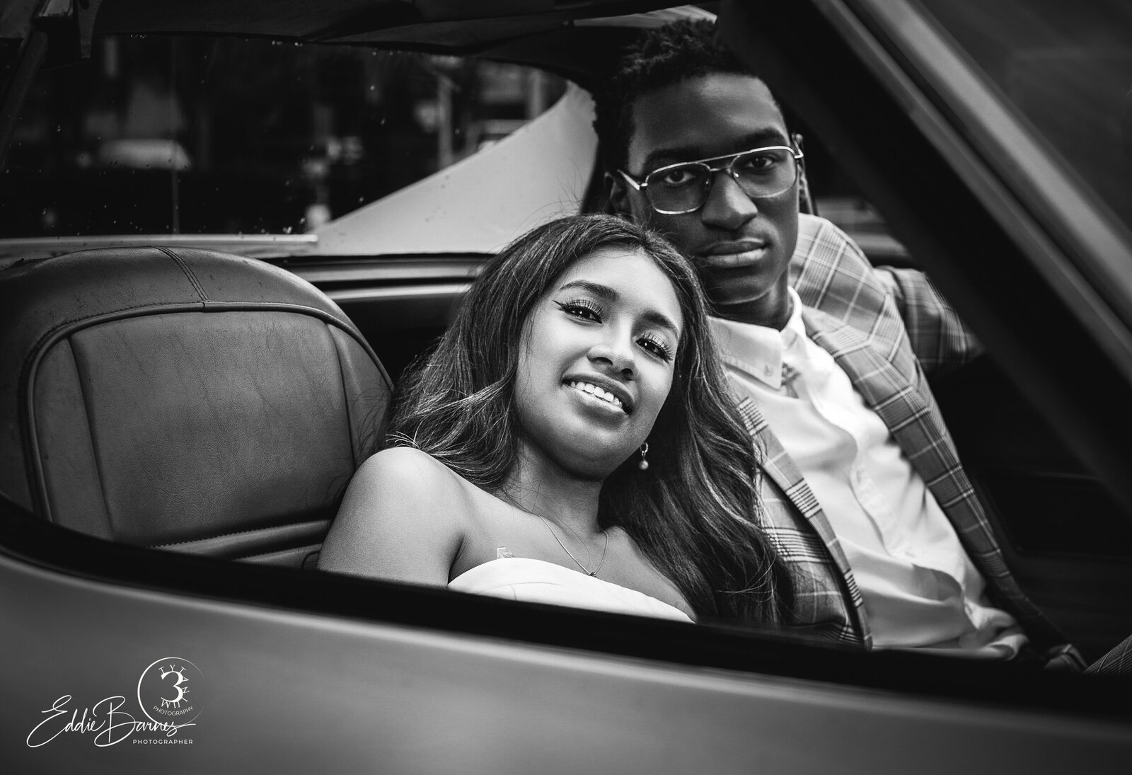 black and white image of couple in vette