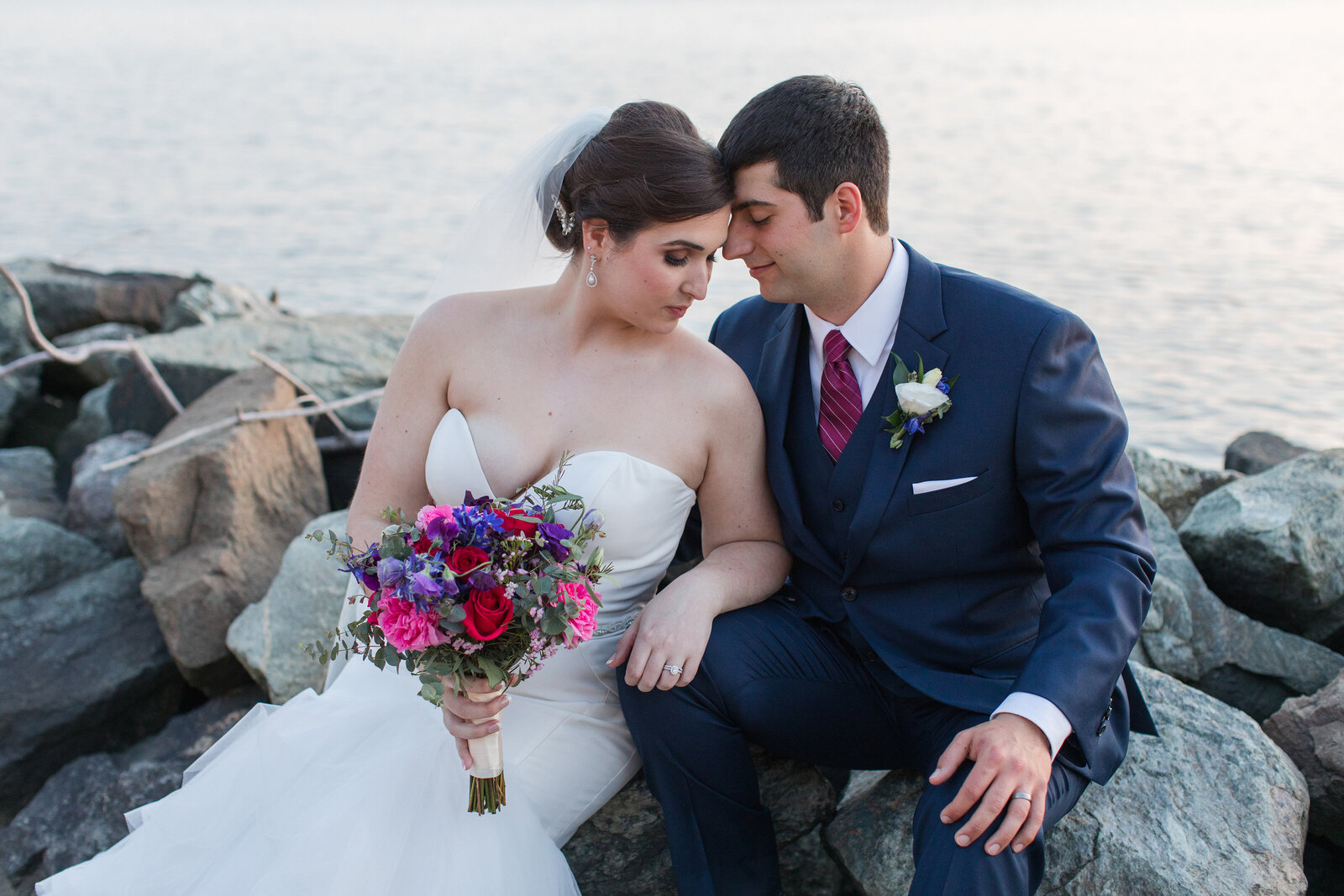 Chesapeake Bay Beach Club wedding photo of couple on rock Sunset Ballroom by Annapolis Maryland photographer Christa Rae Photography